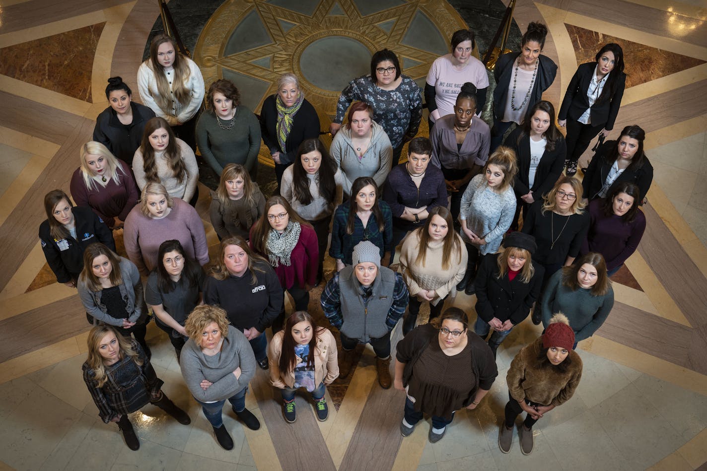 Group photo of participants in the Denied Justice series at the State Capitol in St. Paul, Minn., on December 22, 2018. ] RENEE JONES SCHNEIDER &#xa5; renee.jones@startribune.com