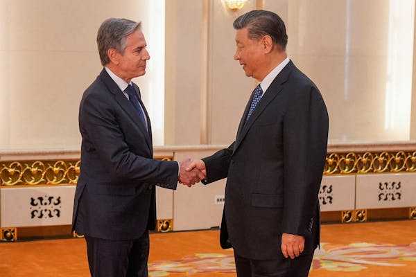 U.S. Secretary of State Antony Blinken (left) shakes hands with China's President Xi Jinping at the Great Hall of the People in Beijing on April 26, 2