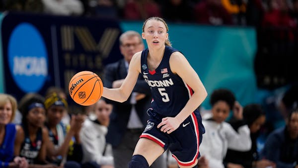 UConn’s Paige Bueckers dribbled upcourt during a semifinal game of the NCAA Women’s Final Four in April at Target Center.
