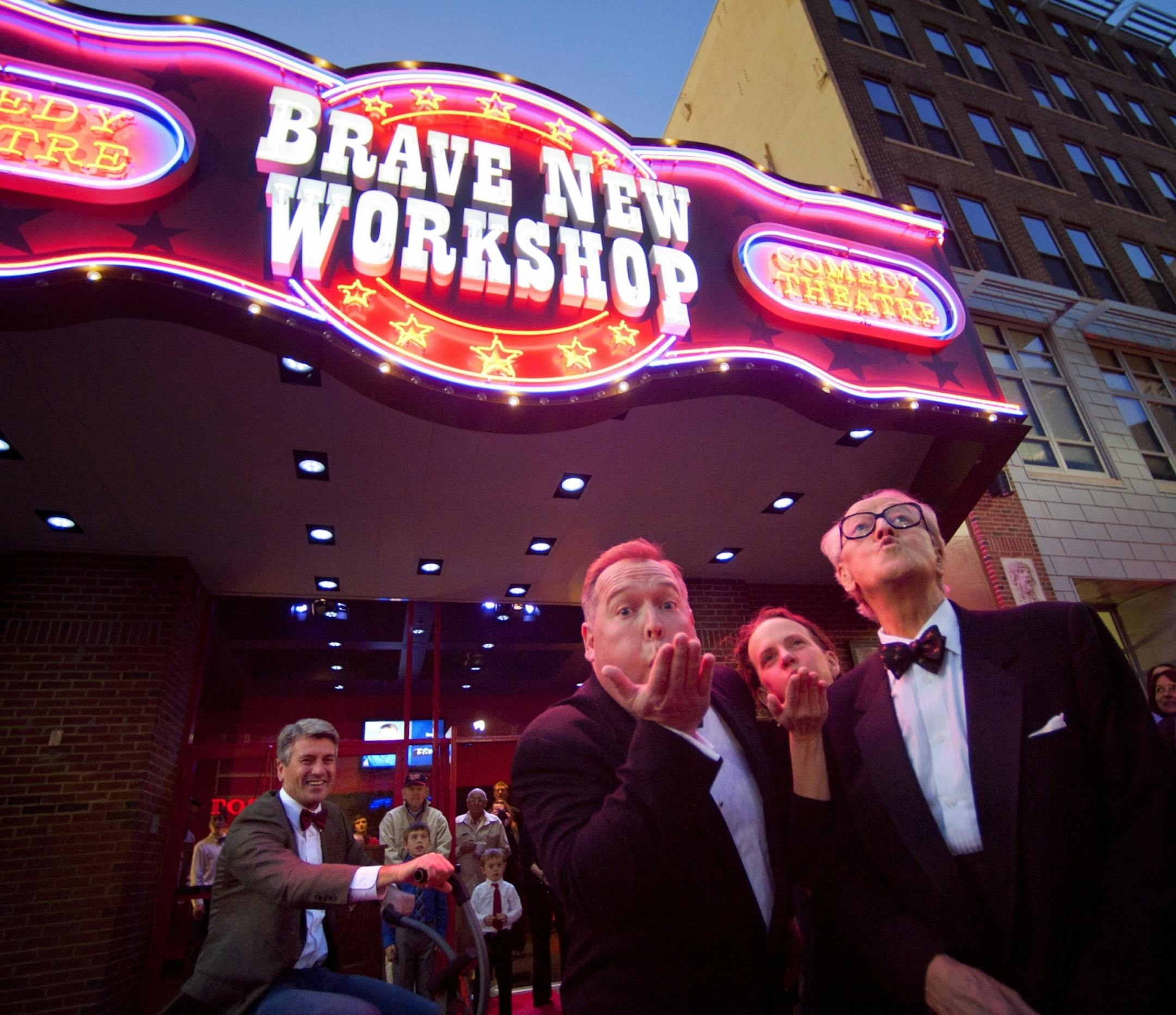 While Mayor R.T. Rybak peddled fast on a stationary bicycle to "power up the lights" Brave New Workshop owners John Sweeney and Jenni Lilledahl along with founder Dudley Riggs, blew the lights on during the opening night marquee lighting ceremony. The Theater commemorated its move from Uptown to new location on Hennepin Ave with an opening night marquee-lighting ceremony.