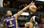 Los Angeles guard Alana Beard contested a shot by Lynx forward Maya Moore during the Sparks' 71-63 victory last August. The teams meet again Tuesday n