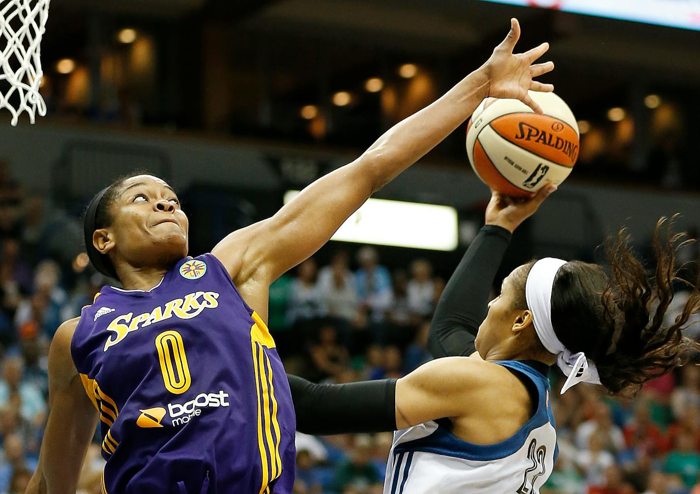 Los Angeles guard Alana Beard contested a shot by Lynx forward Maya Moore during the Sparks' 71-63 victory last August. The teams meet again Tuesday night in Los Angeles.