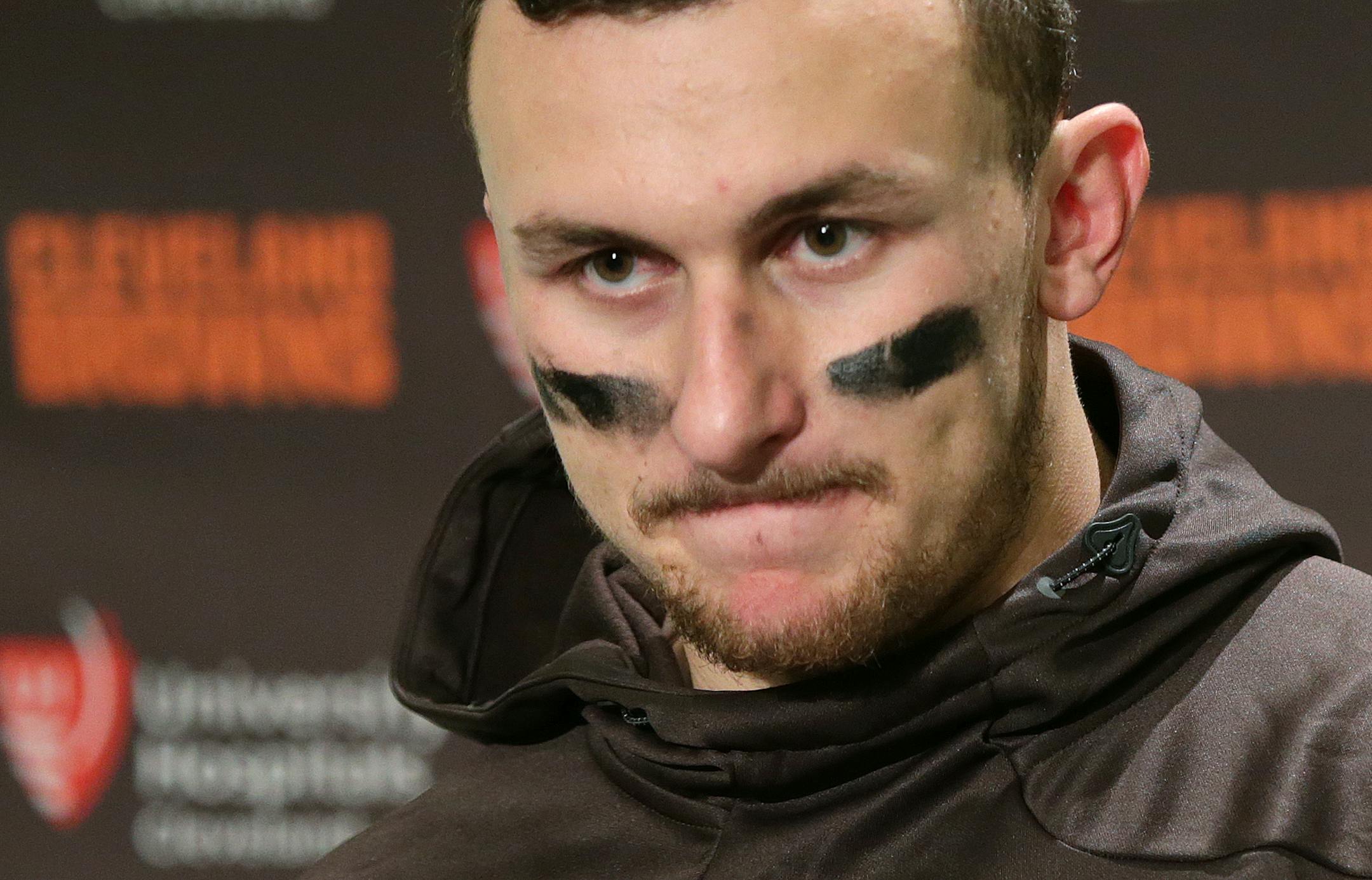 Cleveland Browns quarterback Johnny Manziel speaks with media members after an NFL football game against the Seattle Seahawks, Sunday, Dec. 20, 2015, in Seattle. The Seahawks won 30-13.