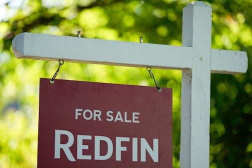 A "For Sale" sign is displayed outside a home on Friday, July 11, 2025, in Portland, Ore.