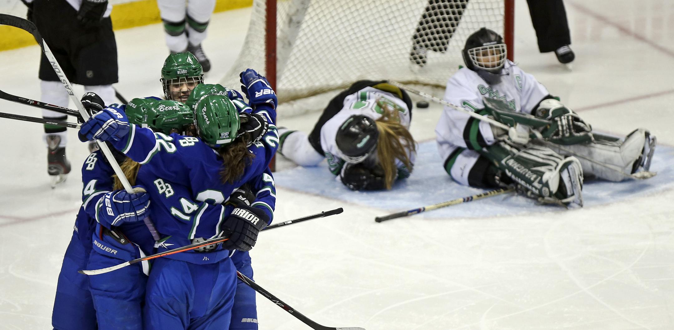 Blake School's Carly Bullock, front, (22) celebrates her assist with teammates on a goal by Sylvie Wallin, middle rear, that tied the game at 2-2 during the second period against East Grand Forks High. Blake won on a 3-2 come-from-behind victory over East Grand Forks High Saturday, March 22, 2014, at the Xcel Energy Center In St. Paul, MN.](DAVID JOLES/STARTRIBUNE) djoles@startribune.com Girls' hockey, Class 1A championship game Saturday, March 22, 2014, at the Xcel Energy Center In St. Paul, MN