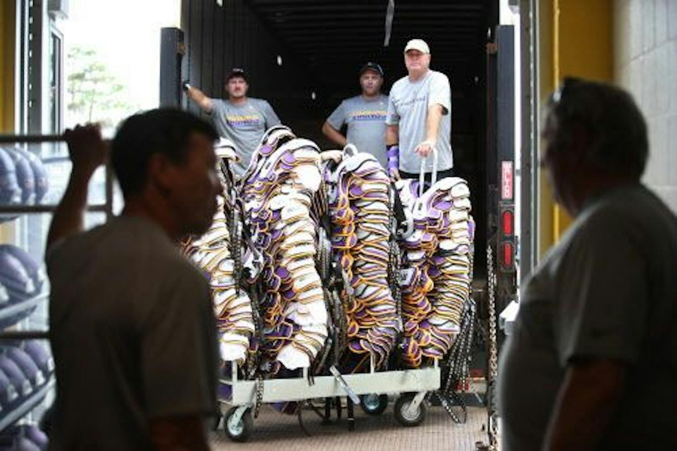 Minnesota Vikings equipment manger Dennis Ryan left , watched as shoulder pads were loaded on a truck as the team prepared to leave Minnesota State University after 52 years in Mankato.