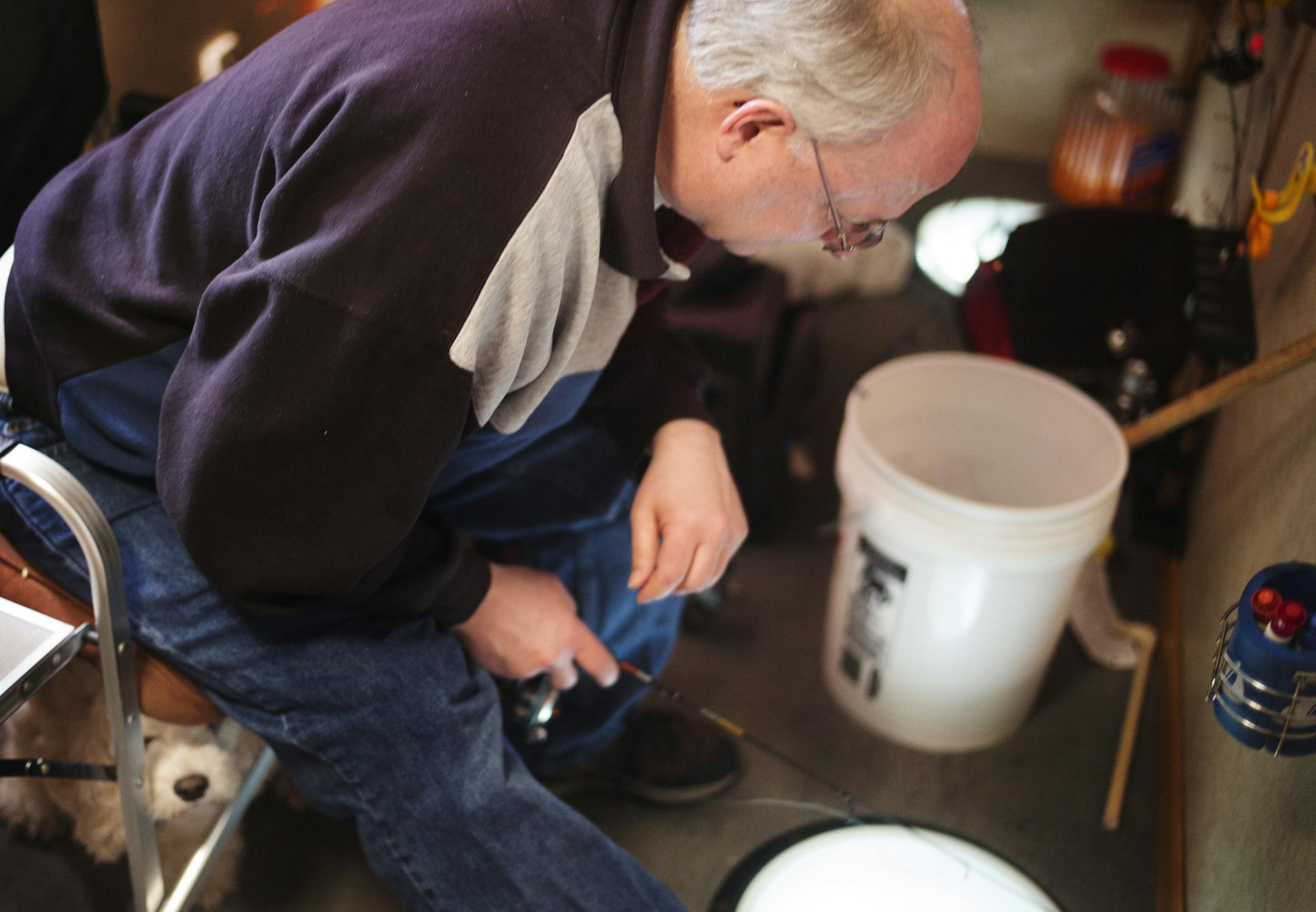 On Medicine Lake, Charlie Snorek and his dog Lilly were still in the ice house going for pan fish before the deadline at midnight for the southern half of the state.] Snorek's ice house has retractable wheels and can be moved very easily.] Richard Tsong-Taatarii/rtsong-taatarii@startribune.com