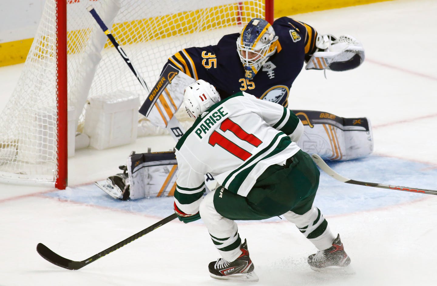 Wild forward Zach Parise puts the puck past Buffalo goalie Linus Ullmark during the first period