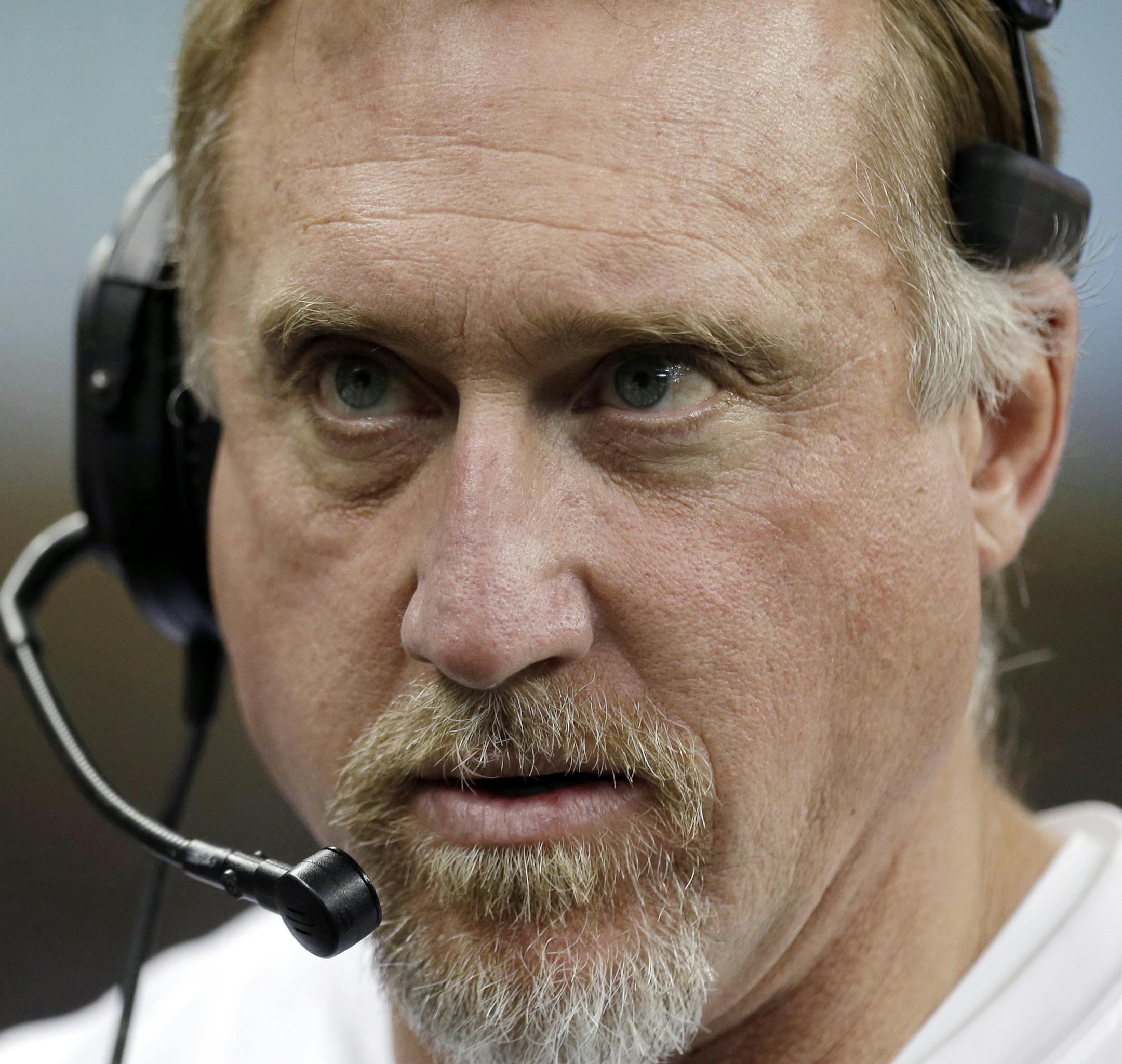 FILE - In this Nov. 18, 2012, file photo, Green Bay Packers outside linebackers coach Kevin Greene watches during the first half of an NFL football game against the Detroit Lions in Detroit. Greene is stepping away from coaching to spend more time with his wife and children. Coach Mike McCarthy announced Greene's decision Friday, Jan. 17, 2014. (AP Photo/Paul Sancya, File) ORG XMIT: NY156