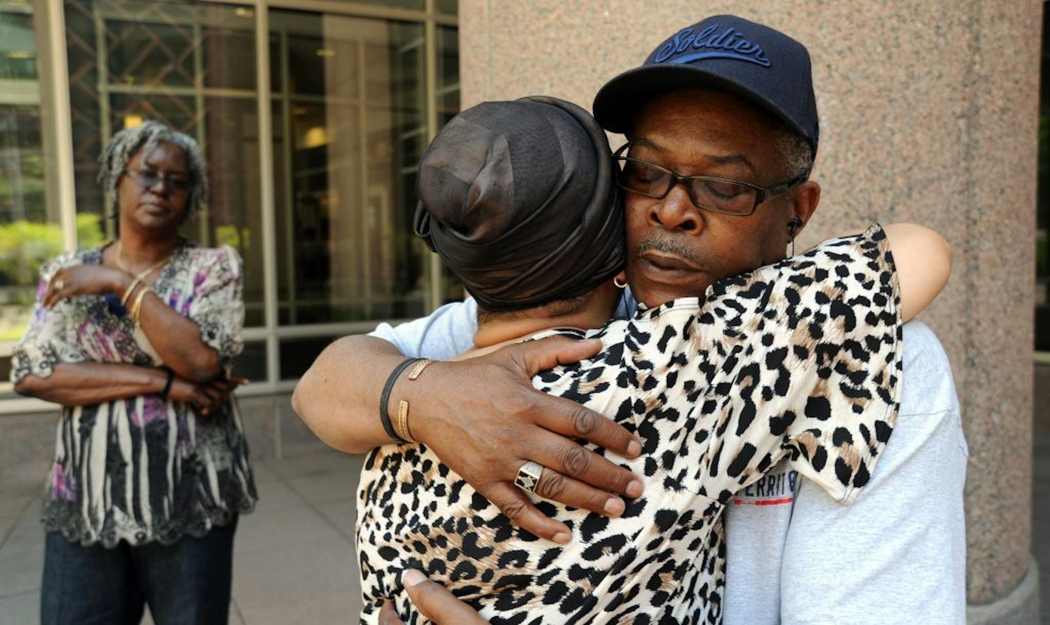 The first appearance for Eddie Moseley, the suspect in the triple homicide in Brooklyn Park was Friday at the Hennepin County Jail courtroom. Before the court appearance James Bolden of Brooklyn Park, the brother of one of teh victims. embraced Norma McLoyd of Minneapolis, a family friend.