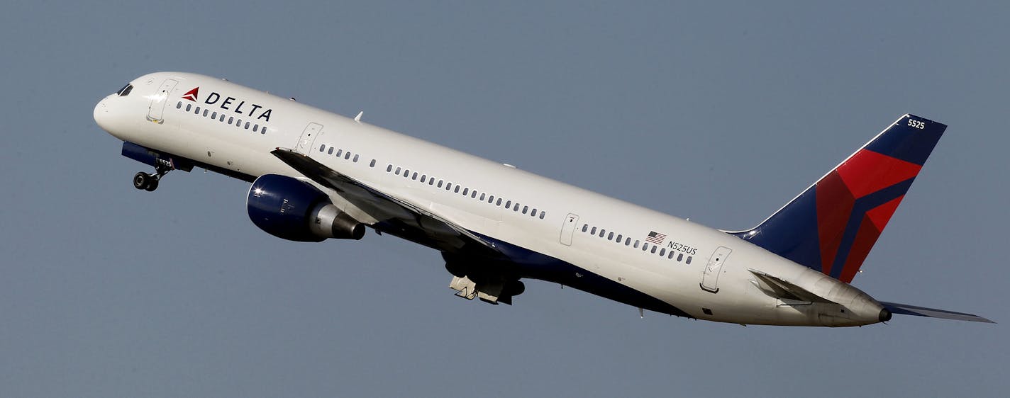 File-This photo taken Jan. 20, 2011, shows a Delta Airlines Boeing 757 taking off in Tampa, Fla. Delta Air Lines is making fundamental changes to its frequent flier program and will reward those who buy its priciest tickets, as opposed to those who fly the most miles. The airline said Wednesday, Feb. 26, 2014, that the 2015 SkyMiles program will better recognize frequent business travelers and leisure customers who buy premium fares. (AP Photo/Chris O'Meara, File) ORG XMIT: MIN2014022620373935