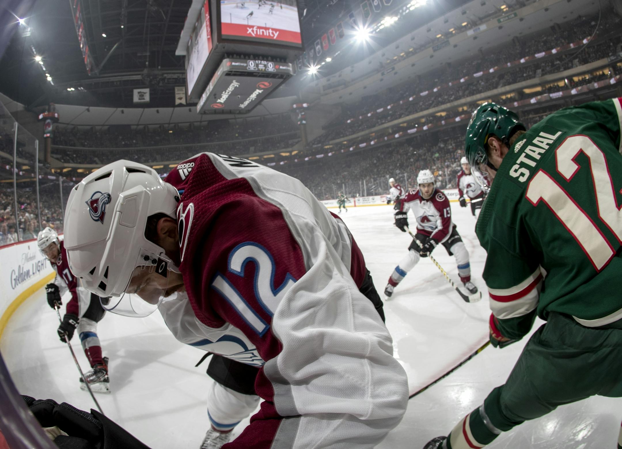 Patrik Nemeth (12) and Eric Staal (12) fought for the puck in the first period.