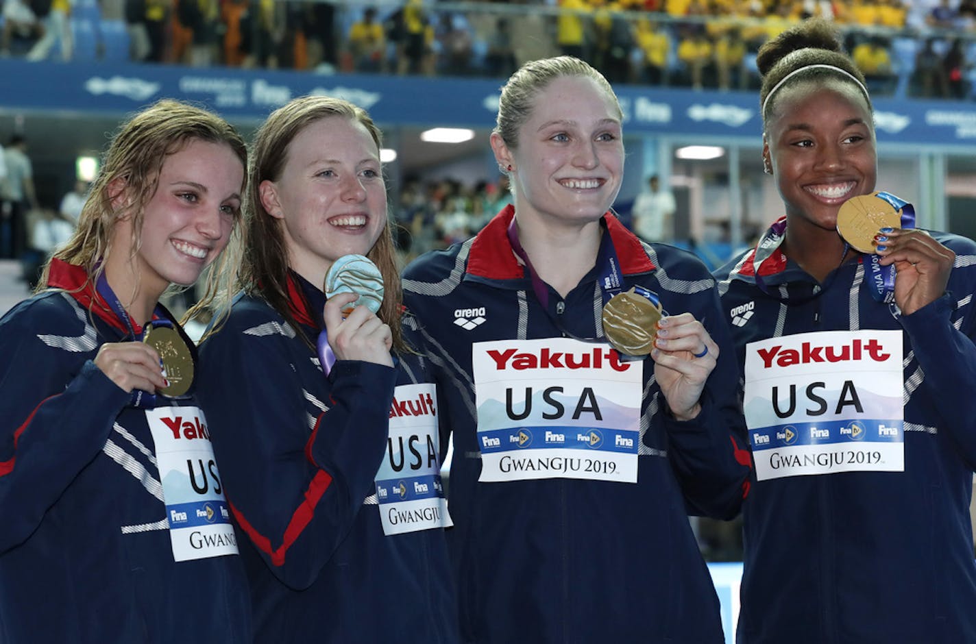 The United States women's 4x100m medley relay team (from left, Lakeville's Regan Smith, Lilly King, Kelsi Dahlia and Simone Manuel) posed with their gold medals at the World Swimming Championships in Gwangju, South Korea, on Sunday.