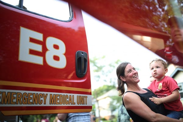 Christine Rohr and her son Jude checked out a fire truck during National Night Out in south Minneapolis in 2017.