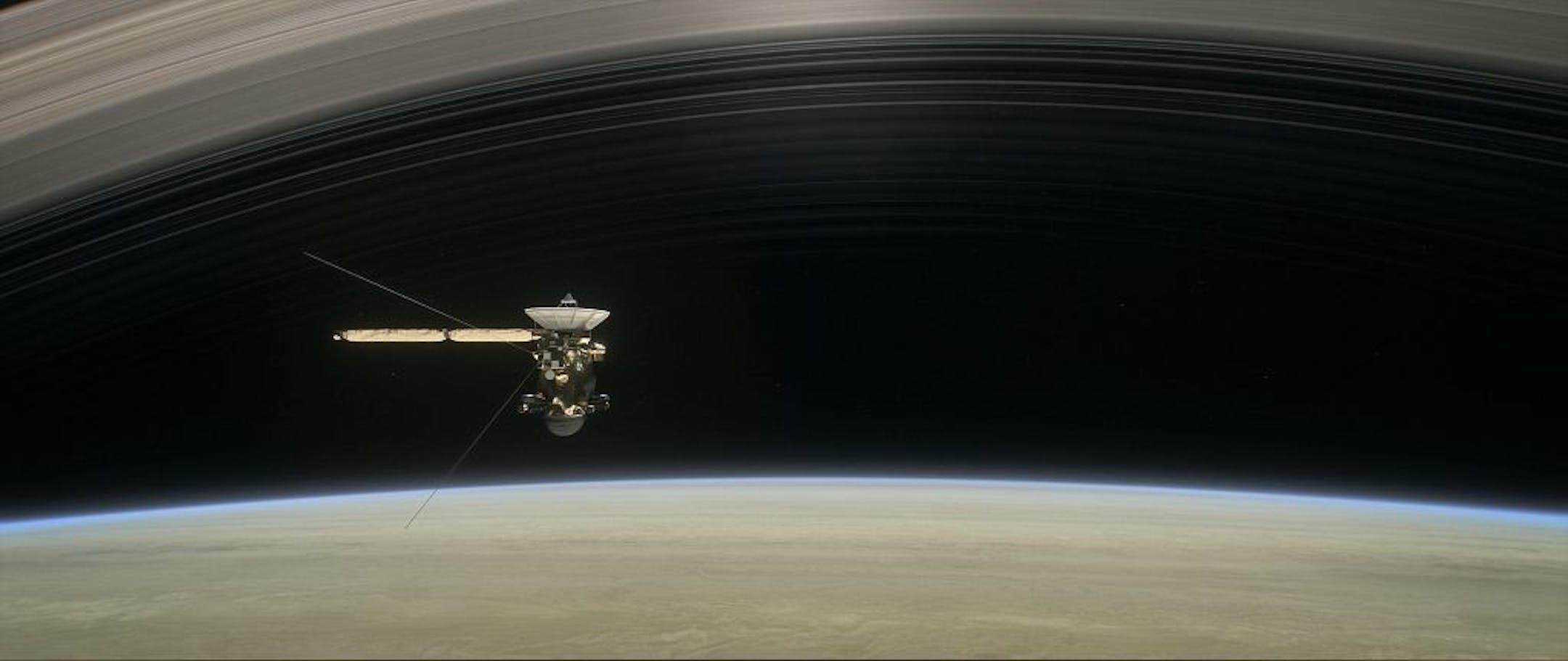 This image made available by NASA in April 2017 shows a still from the short film "Cassini's Grand Finale," with the spacecraft diving between Saturn and the planet's innermost ring. Launched in 1997, Cassini reached Saturn in 2004 and has been exploring it from orbit ever since. Cassini�s fuel tank is almost empty, so NASA has opted for a risky, but science-rich grand finale.