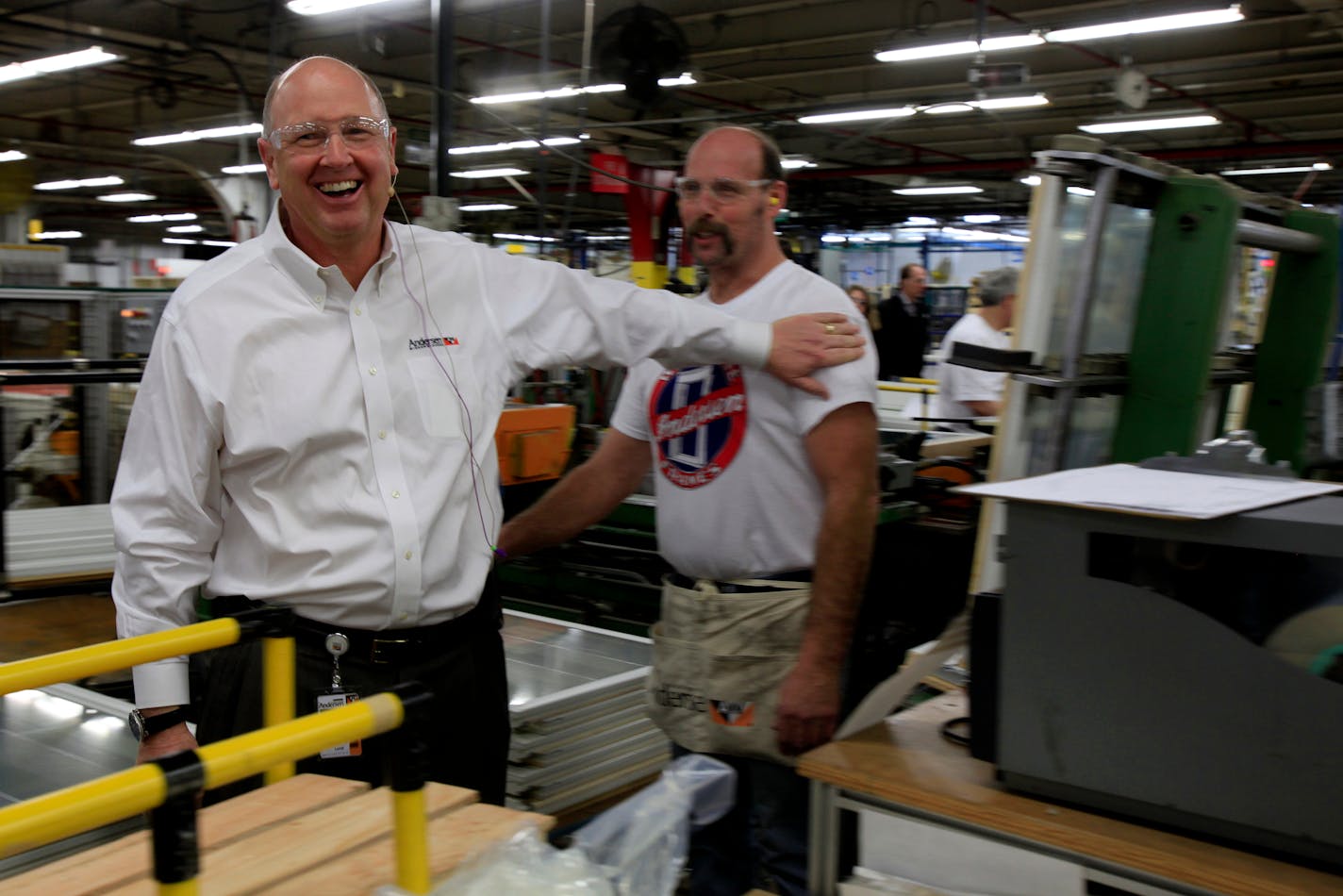 Jay Lund, CEO of Andersen Windows and Doors had a laugh with one the workers at the production line before producing its last Narrowline window. Bayport, MN on January 31, 2013. ] JOELKOYAMAâ€¢joel.koyama@startribune.com