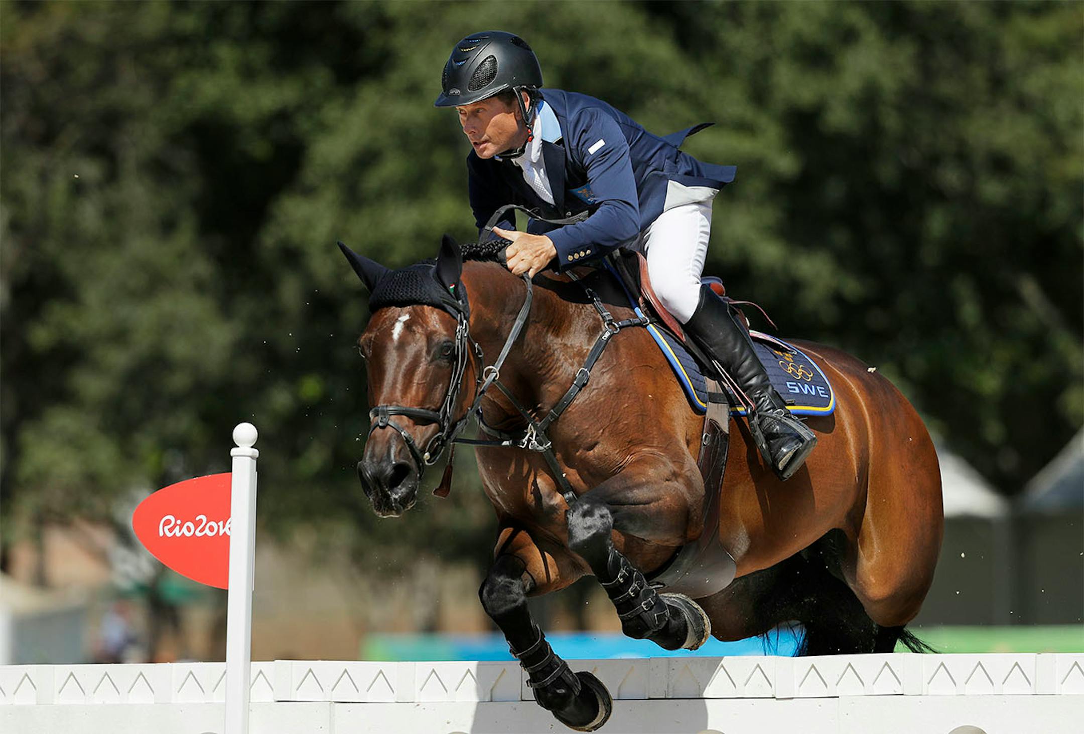 Sweden's Rolf-Goran Bengtsson, riding Unita, competes in the equestrian jumping competition at the 2016 Summer Olympics in Rio de Janeiro, Brazil, Sunday, Aug. 14, 2016.