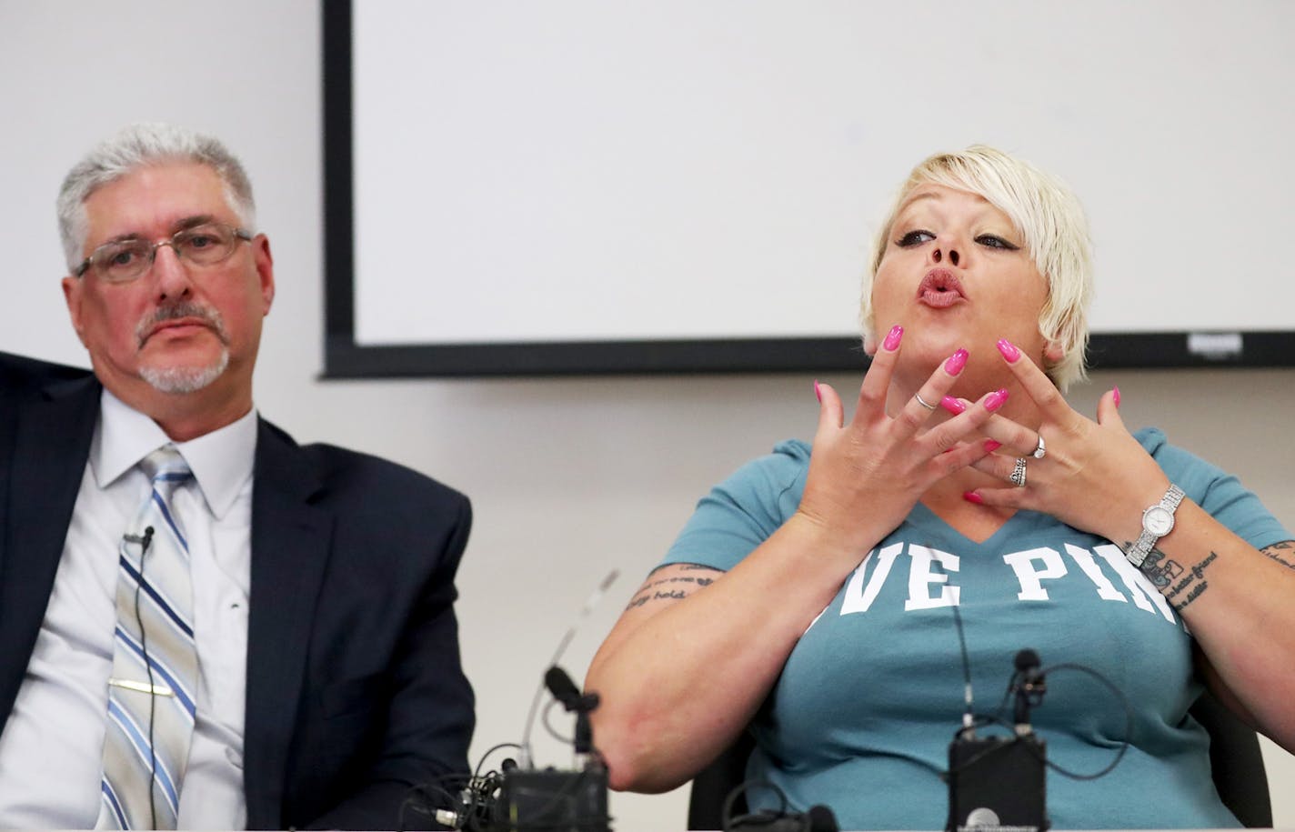 During a press conference about police body cam video released that shows dogs being shot by a Minneapolis police officer, the dogs owner Jennifer LeMay talks about the bullet wound to Ciroc and the medical issues is has since caused with her attorney Mike Padden, left, seated nearby at the Minneapolis Urban League Wednesday, July 19, 2017, in Minneapolis, MN.