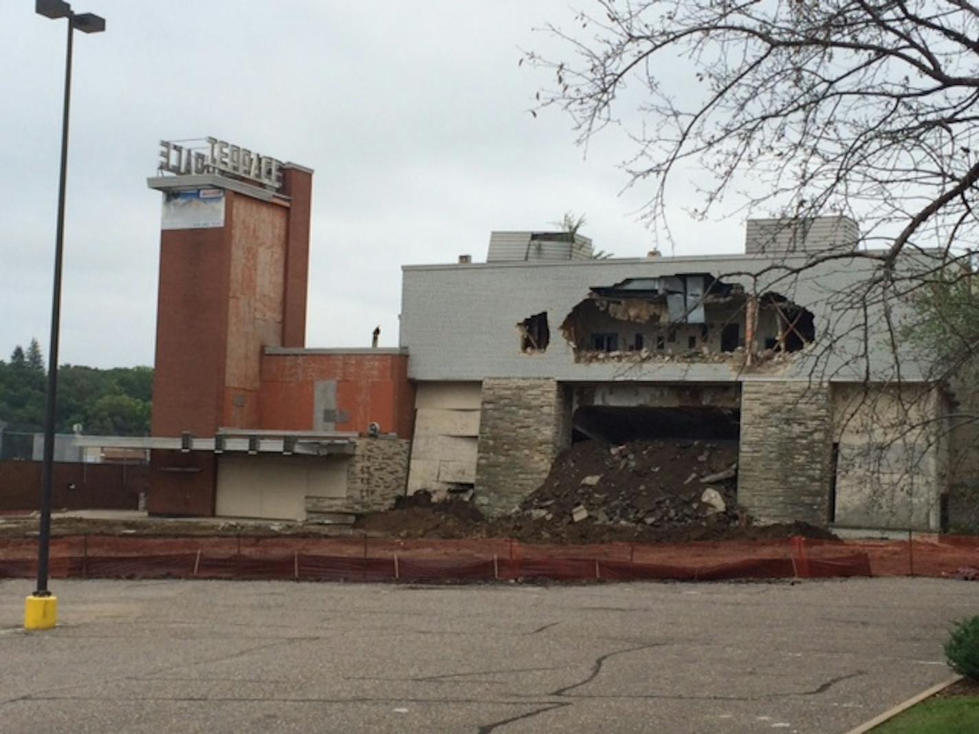 Photo by Liz Sawyer. Saturday's demolition effort was halted, but not before a lot of damage was done.