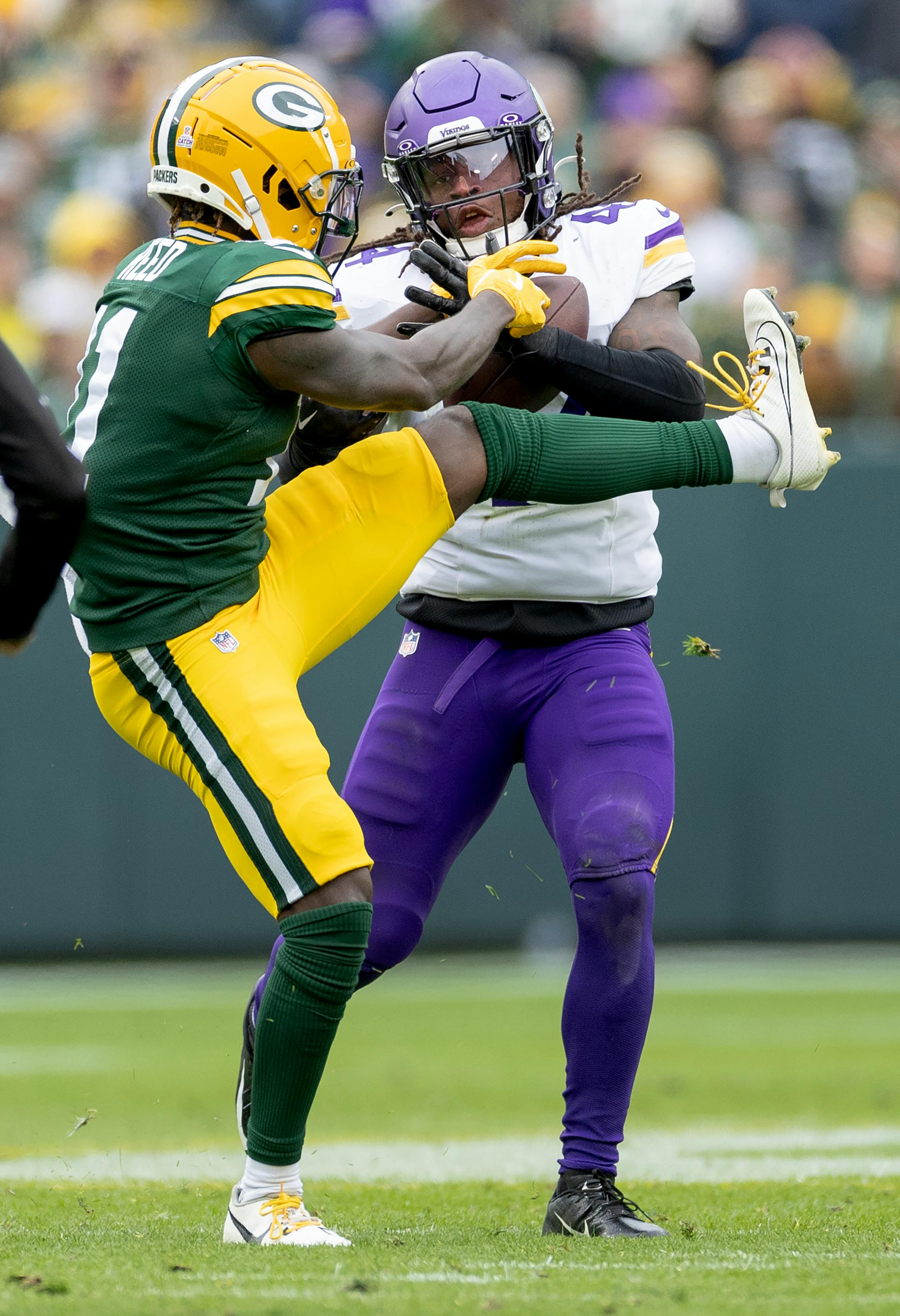 Minnesota Vikings linebacker Josh Metellus (44) intercepts a pass intended by Jayden Reed (11) of the Green Bay Packers in the third quarter Sunday, October 29, 2023, at Lambeau Field in Green Bay, Wis. ] CARLOS GONZALEZ • carlos.gonzalez@startribune.com