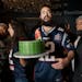 Meir Kay, founder of Super Soul Party, holds a cake at a Super Bowl party organized by his nonprofit organization for homeless people, on Feb. 3, 2019