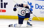 Winnipeg Jets defenseman Josh Morrissey (44) celebrates after his goal during the third period of an NHL hockey game against the Buffalo Sabres, Sunda