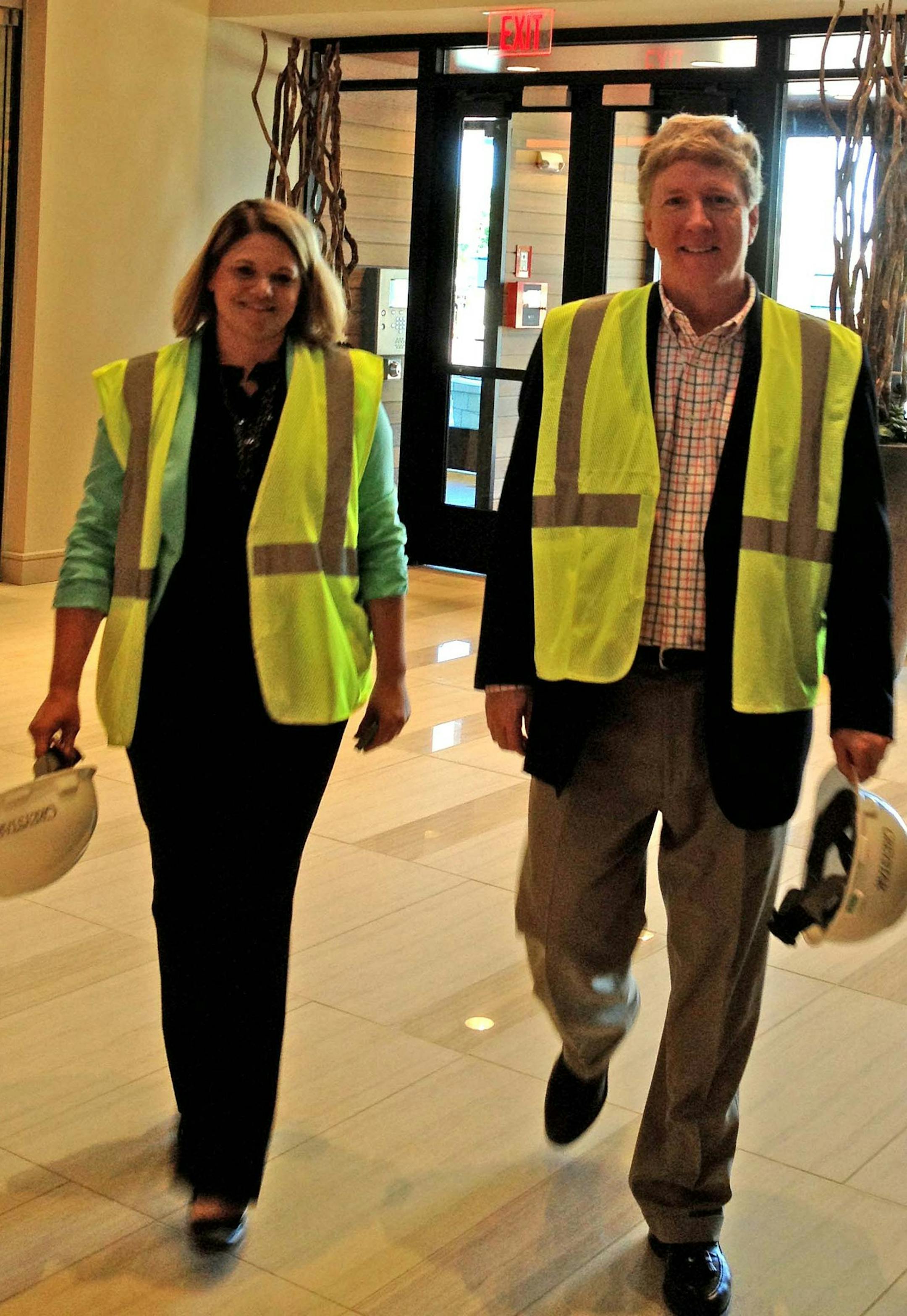 Construction of the second phase of the Elan Uptown apartments on 28th and Dupont Avenue in the Uptown neighborhood helped boost housing construction nearly 40 percent during June. Such multi-family buildings accounted for half of all housing construction last month. David Reid, managing director of development for Greystar, and Angelia Jarvis, community manager for Elan Uptown, in the main lobby of Phase 1. Photo credit: Jim Buchta/Star Tribune