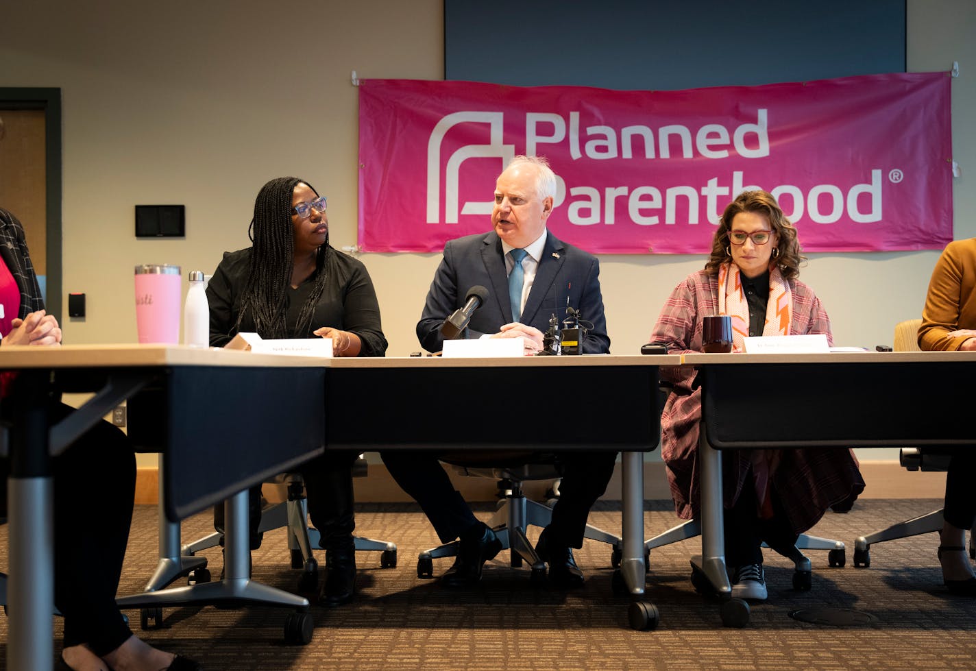 Gov. Tim Walz, center, and Lt. Gov. Peggy Flanagan, right, joined CEO of Planned Parenthood North Central States Ruth Richardson, left, for a discussion about abortion in Minnesota and surrounding states at Planned Parenthood on Monday, Jan. 8, 2024 in St. Paul, Minn. ] tRENEE JONES SCHNEIDER • renee.jones@startribune.com