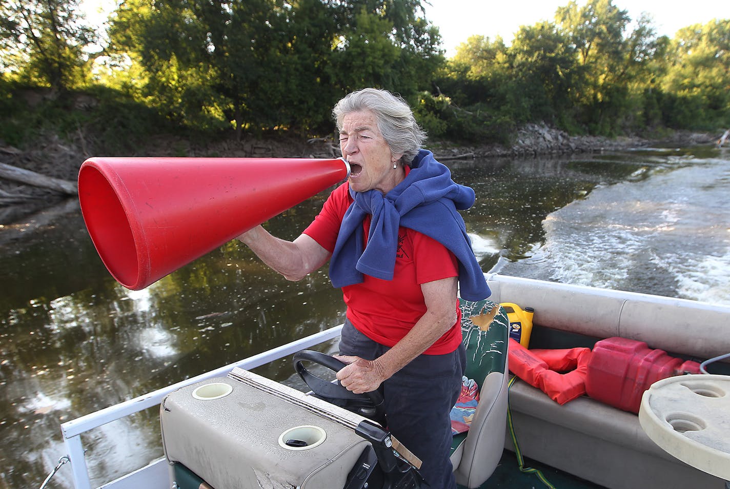 Minnesota Boat Club rowing coach Miriam Baer, 72, shouted out directions to rowers through a megaphone during practice last week.