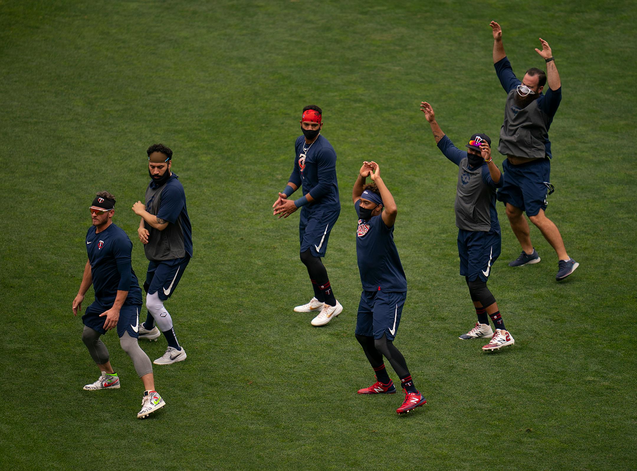 Twins infielders warmed up before working out Monday afternoon.