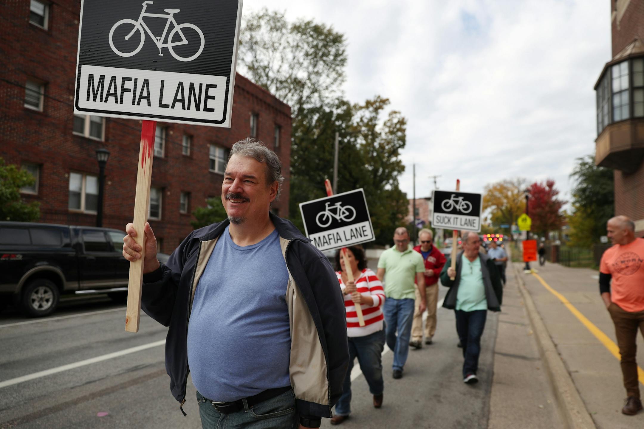Greg Kline of Minneapolis led the protest against bike lines down West 26th Street.