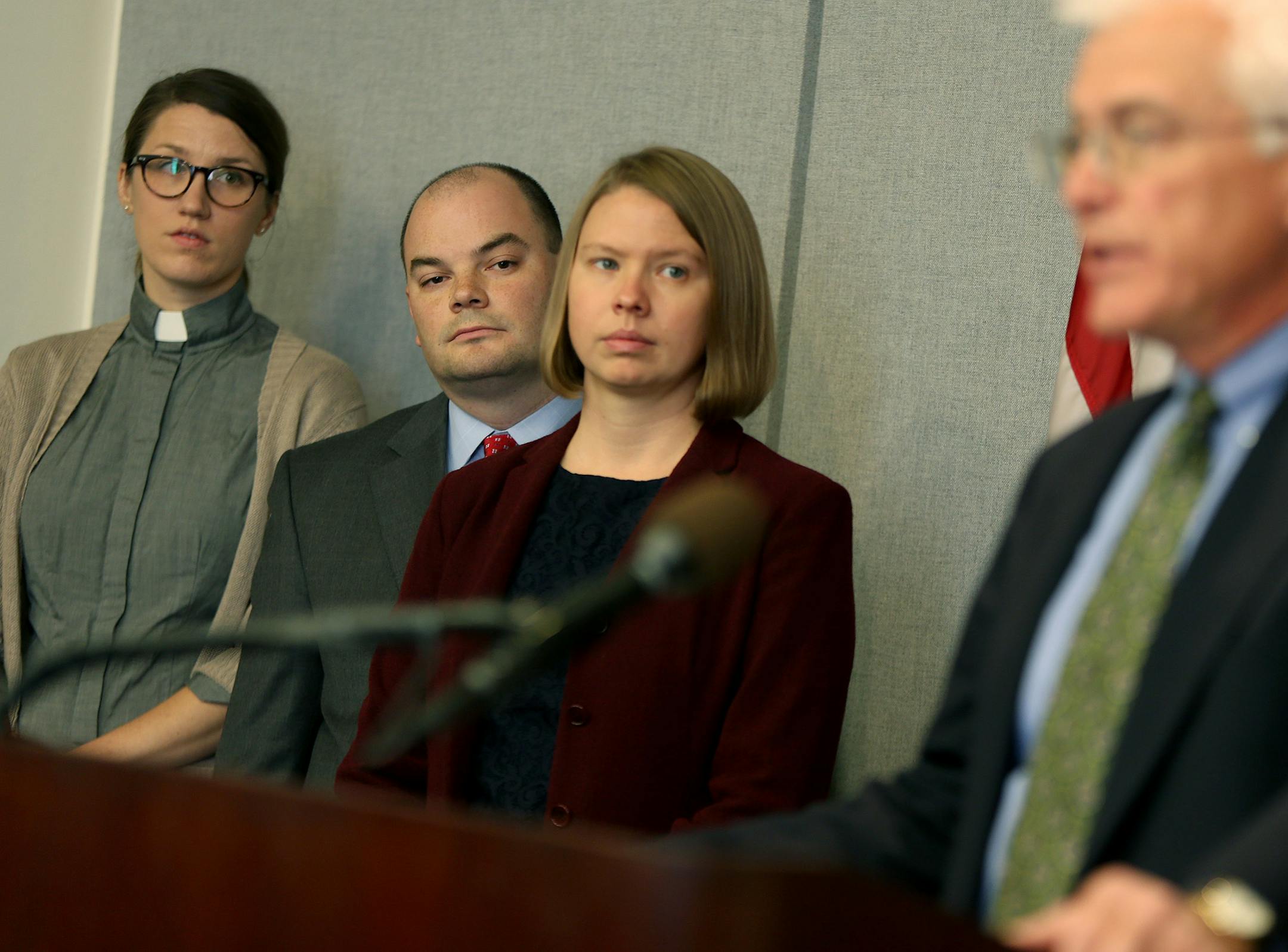 Anna Brelje, a victim of Wells Fargo's payday loan-like "deposit advance" product, watched Brian Rusche talk about the concerns of payday loans in a press conference at the State Capitol, Tuesday, November 12, 2013. Brelje joined the Joint Religious Legislative Coalition to call for an end to predatory payday loan practices. A new payday report is showing an explosive growth of payday lending in Minnesota. (ELIZABETH FLORES/STAR TRIBUNE) ELIZABETH FLORES ¬• eflores@startribune.com OR