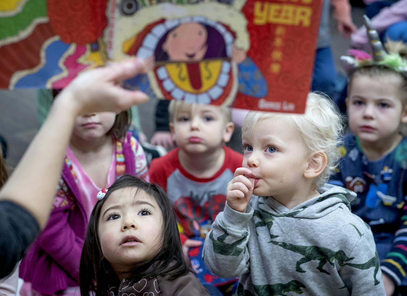 Children listened to Children's Librarian Nicole Brinkman read a book during story time at the Ramsey County Library, Tuesday, January 7, 2020 in Roseville, MN. ] ELIZABETH FLORES &#x2022; liz.flores@startribune.com