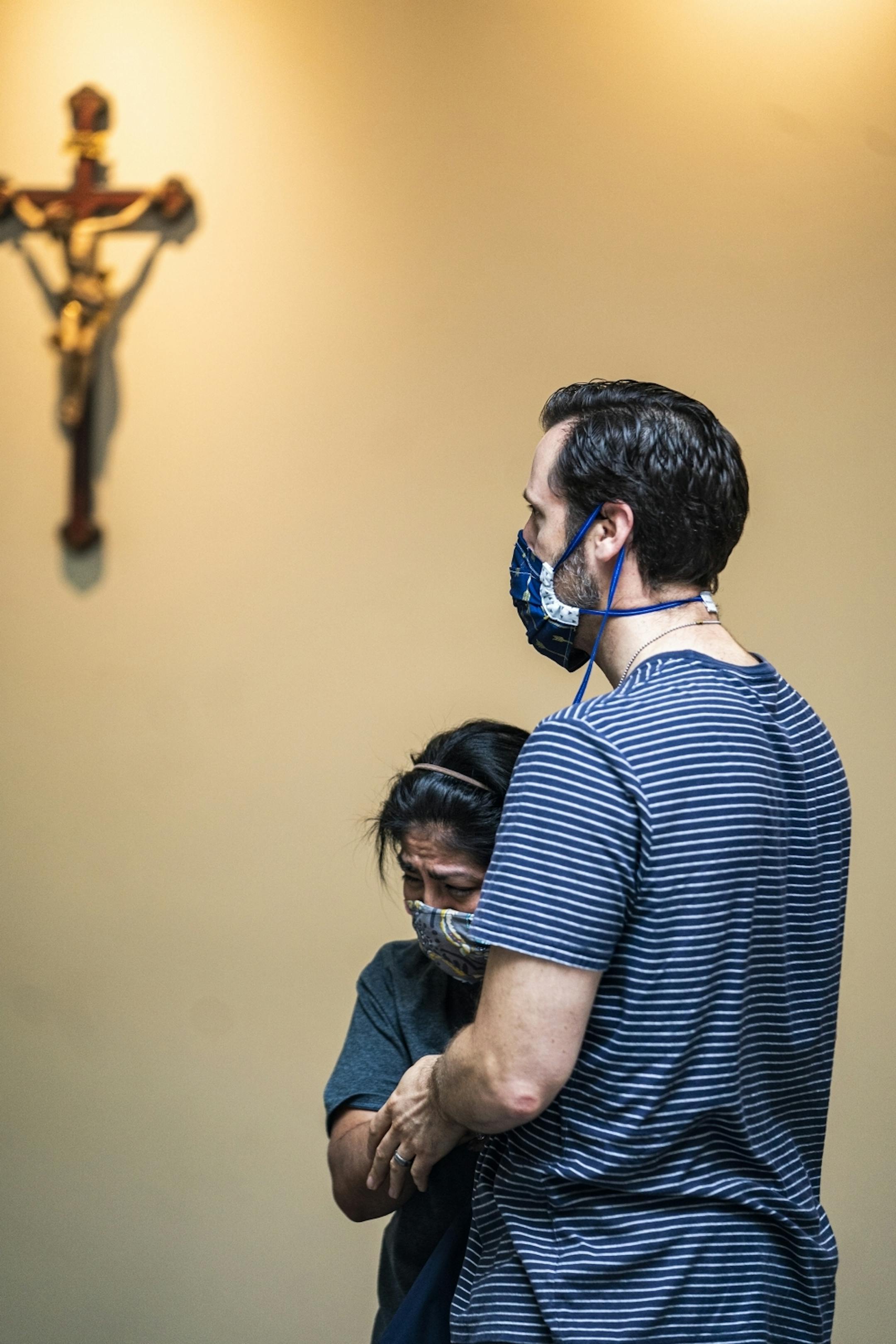 Scott Himmer and his wife Marina of St. Paul became overcome with emotion after receiving communion. "We have been waiting and longing for this day," said Scott Himmer.