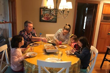 Christina and Mike Goetz of Independence are juggling busy careers and family duties as they adjust to working from home, remote schooling with their 