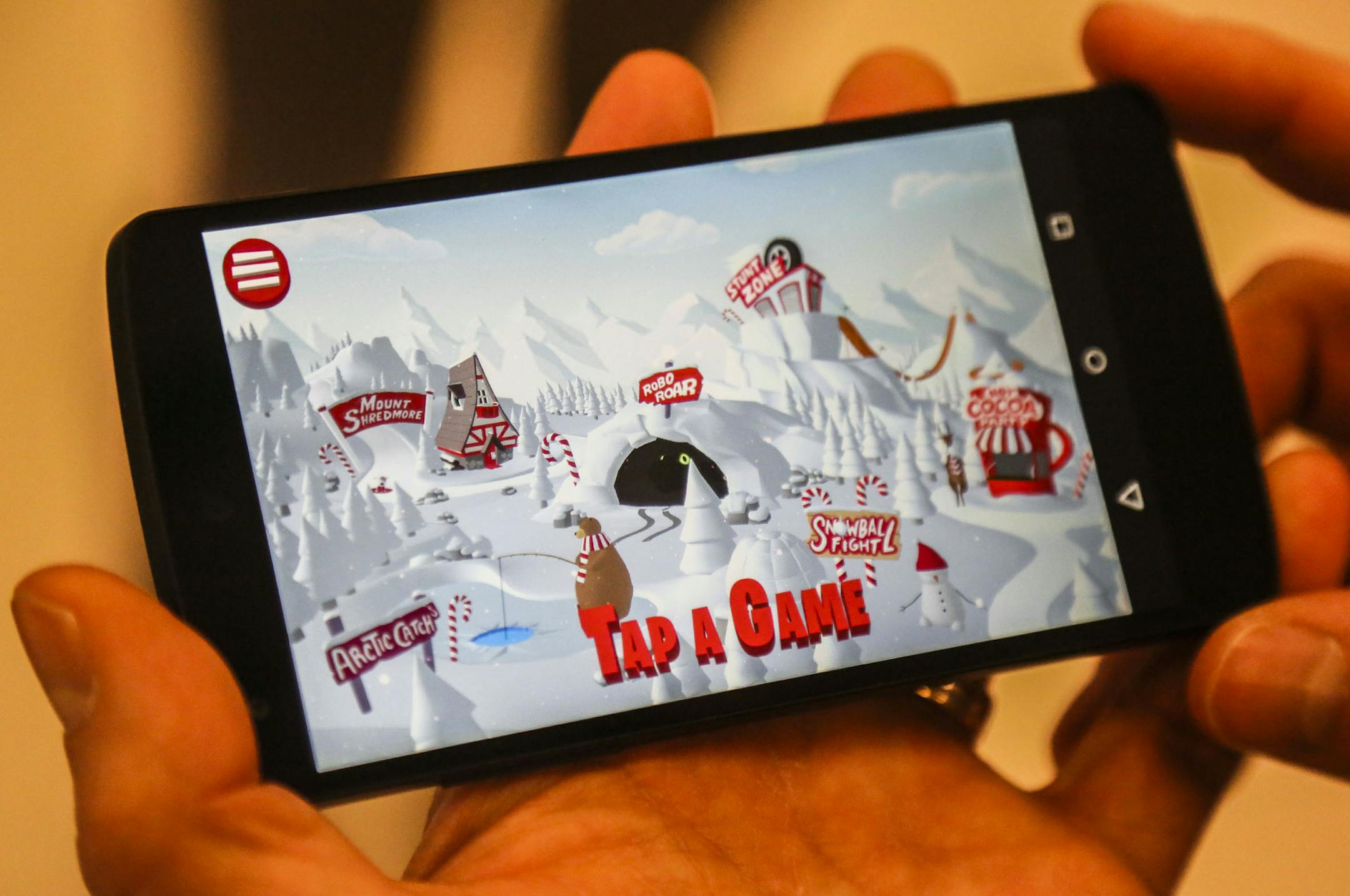 Starting Thursday and running through Sunday, Target in Roseville is one of four stores nationwide to offer an immersive, 3-D gaming experience called Bullseye's Playground and features 6 games. It can be played anywhere on a smartphone or in-store with one of 15 tablets Target will be loaning out to customers for a 10-minute gaming experience in store. Here, Eddie Baeb, Target spokesman, uses his smartphone to show what the Bullseyes's Playground game looks like on a phone. ](DAVID JOLES/STARTR