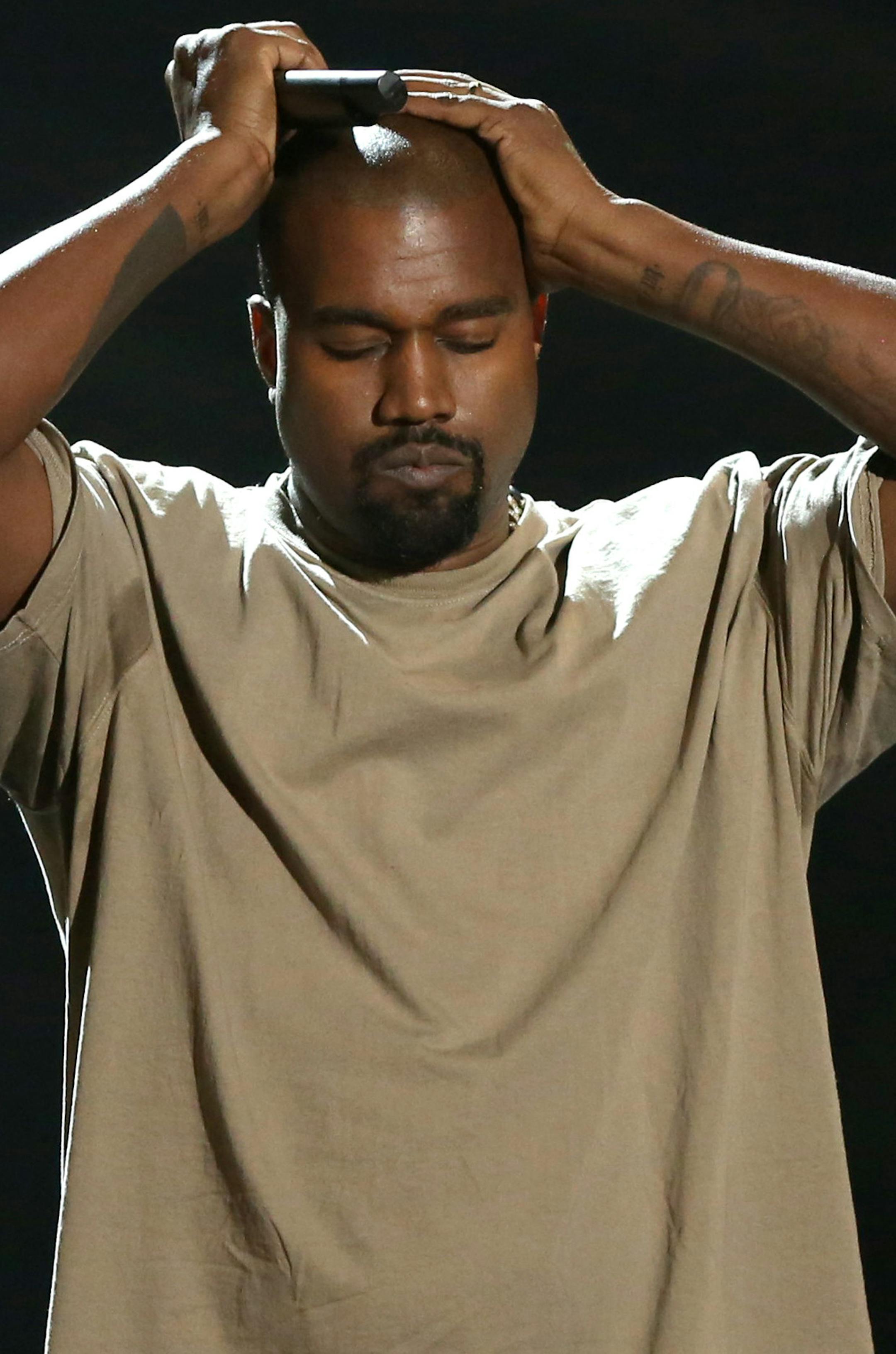 Kanye West reacts as he accepts the video vanguard award at the MTV Video Music Awards at the Microsoft Theater on Sunday, Aug. 30, 2015, in Los Angeles. (Photo by Matt Sayles/Invision/AP)