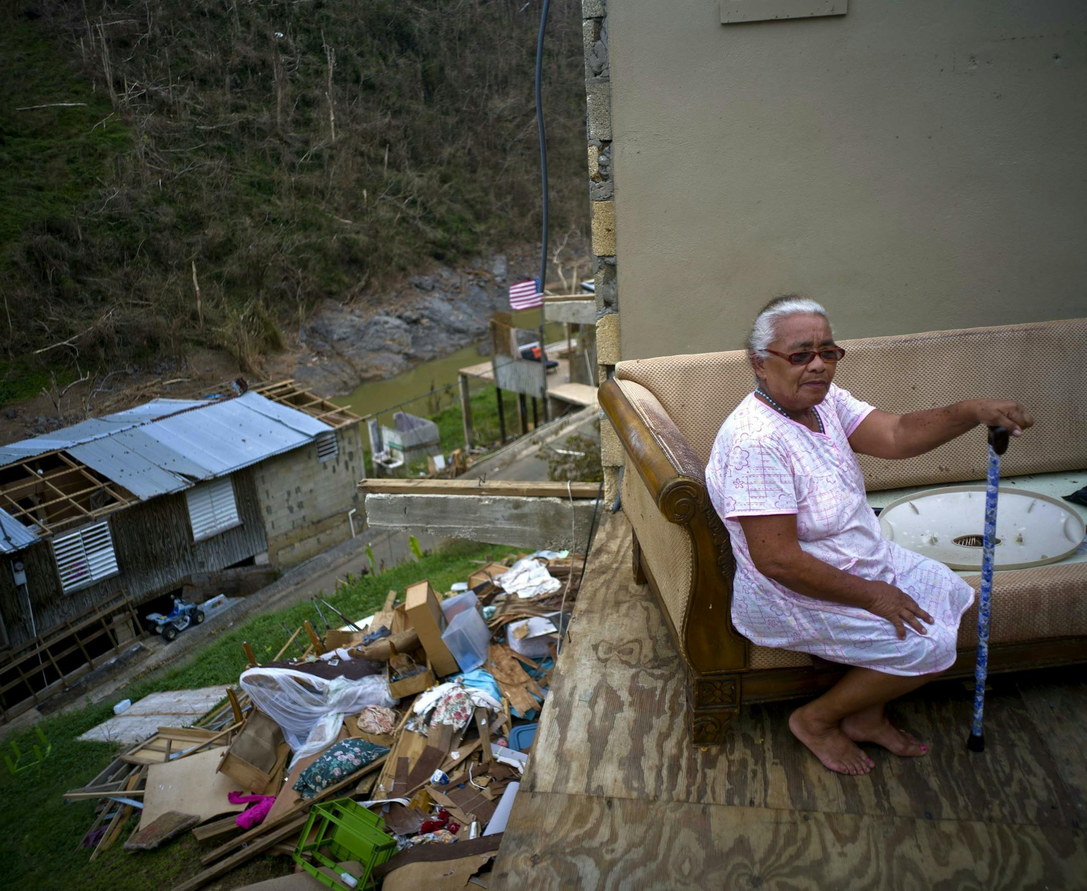 2017 AP LATIN AMERICA YEAR END PHOTOS - Juana Sortre Vazquez sits on her soaked couch in what remains of her home, destroyed by Hurricane Maria in the San Lorenza neighborhood of Morovis, Puerto Rico, Saturday, Sept. 30, 2017. "The night of the hurricane I spent the night at a niece's house. I did not come back for the next nine days because the roads where out. When I made it home I saw that is was all gone. This is a disaster," reflected Vazquez. (AP Photo/Ramon Espinosa)