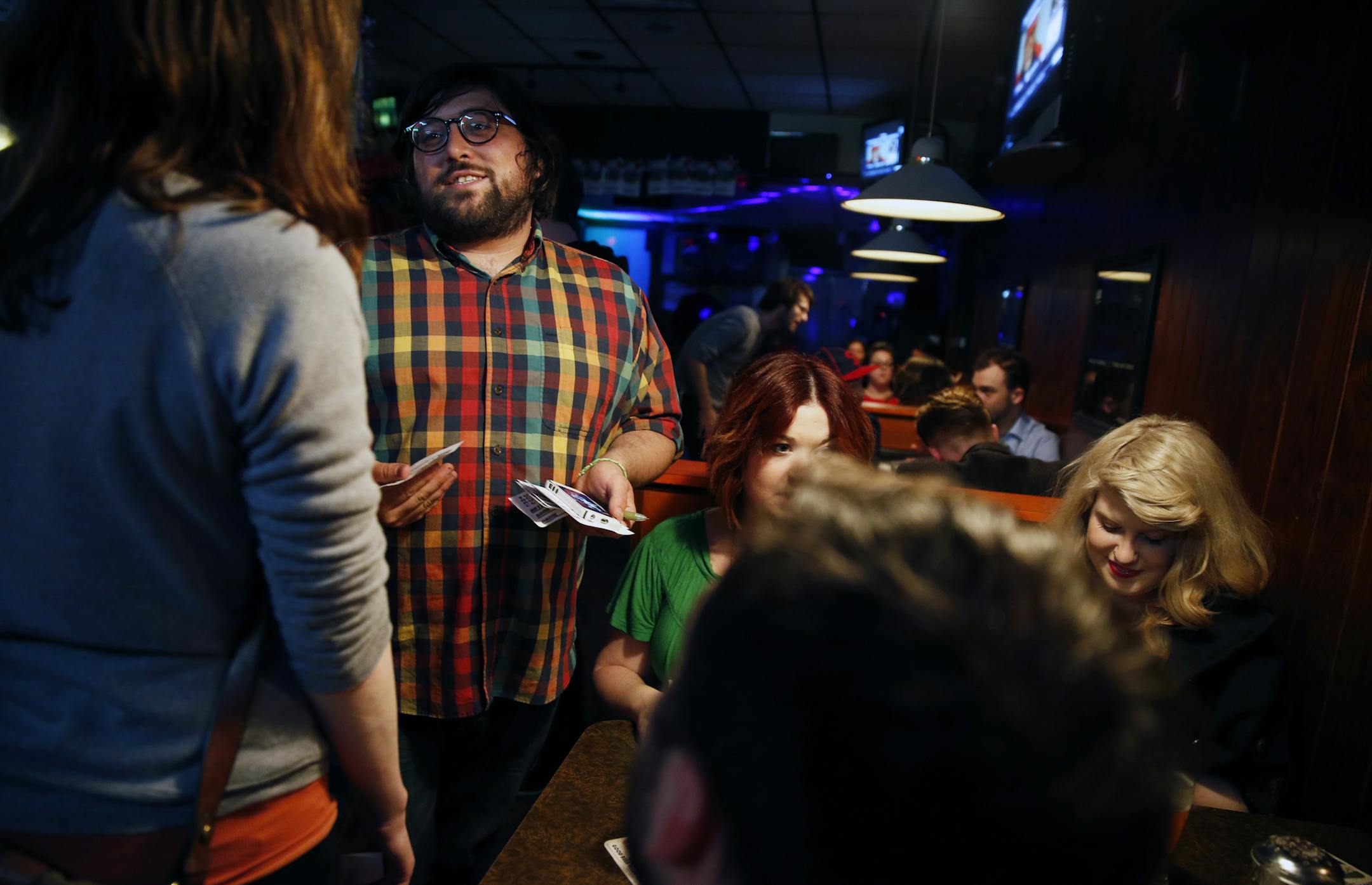 At the Tuesday Night Music Club at the Uptown VFW where cheap drinks and fresh spins by hipster DJ's set the mood, Matthew Jacobs takes requests from the party goers. ] richard tsong-taatarii@startribune.com