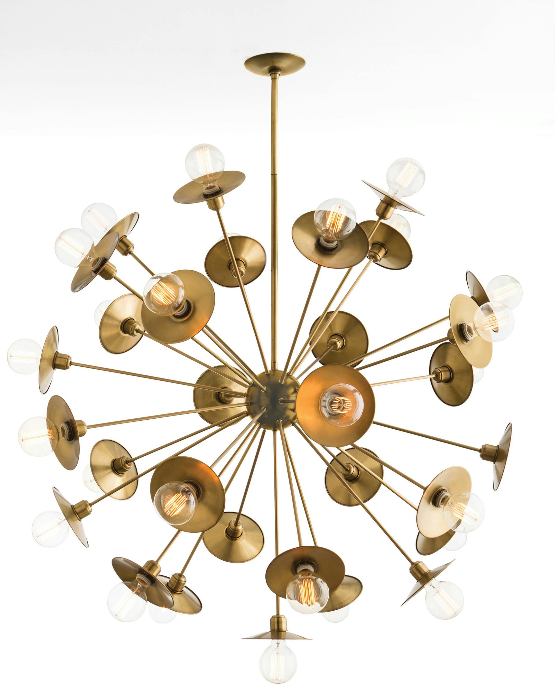 Arteriors Home's High Point showroom was a glow with vintage brass lighting and accessories during spring market. The 30-light Keegan starburst chandelier has an antique brass finish and can be assembled without the circular reflective back plates for an entirely different look. (Agent485/Arteriors Home/MCT) ORG XMIT: 1152251