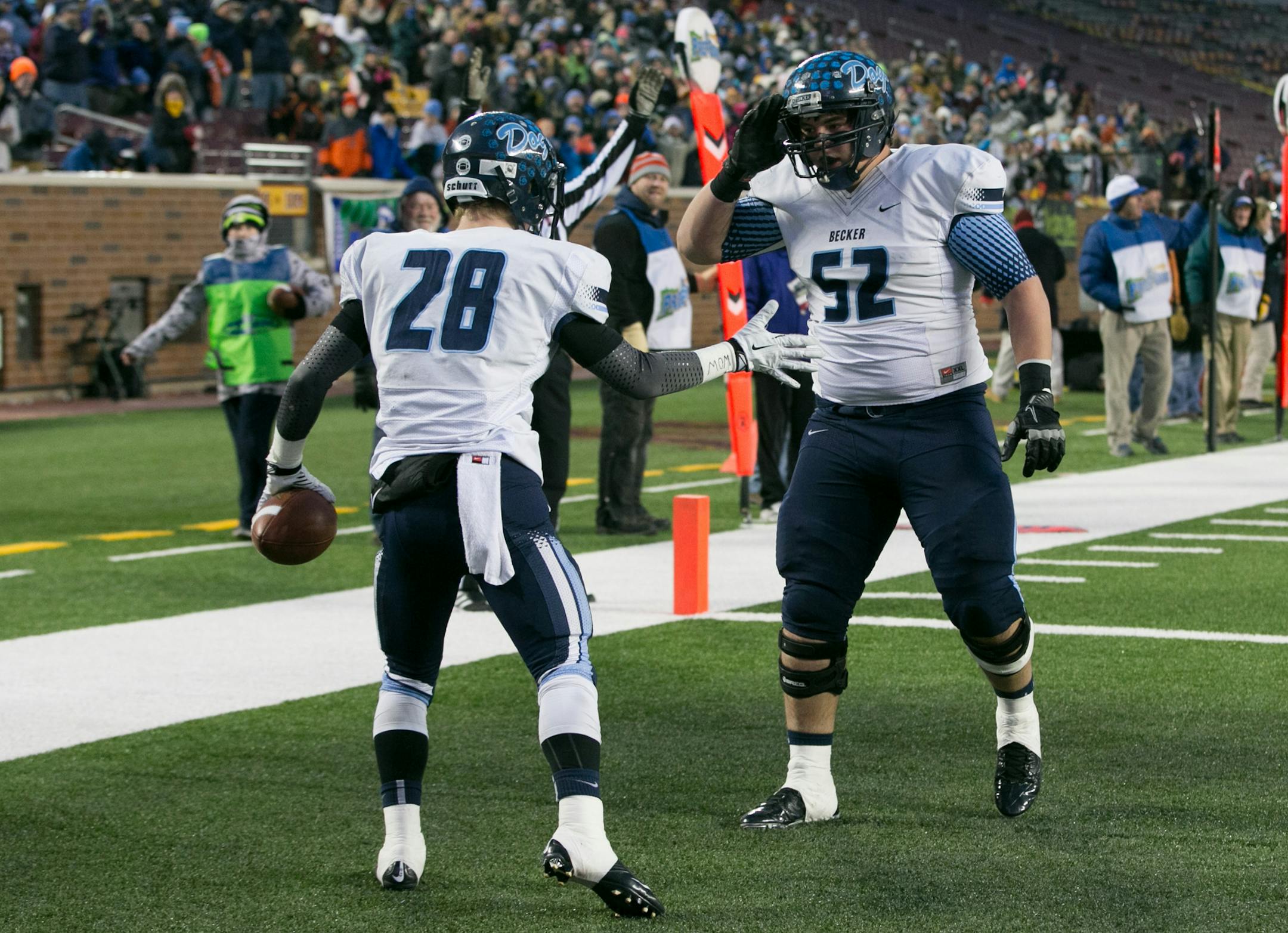 Becker fullback CJ Schwintek (28) celebrates with offensive tackle Casey Vesledahl (52) after Schwintek's rushing touchdown in the second quarter against DeLaSalle. ] AARON LAVINSKY • aaron.lavinsky@startribune.com DeLaSalle takes on Becker in the Class 4A Prep Bowl Friday, Nov. 21, 2014 at TCF Bank Stadium.