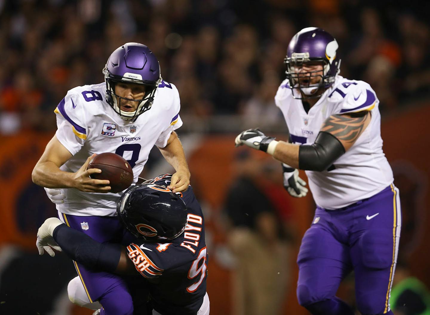 Minnesota Vikings quarterback Sam Bradford (8) was sacked in the end zone by Chicago Bears outside linebacker Leonard Floyd (94) for a safety in the first quarter.