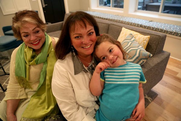 Paula Ogg, left, with her daughter Katy McArron and granddaughter Elizabeth,4. McArron had the basement remodeled and made into a duplex for her and h