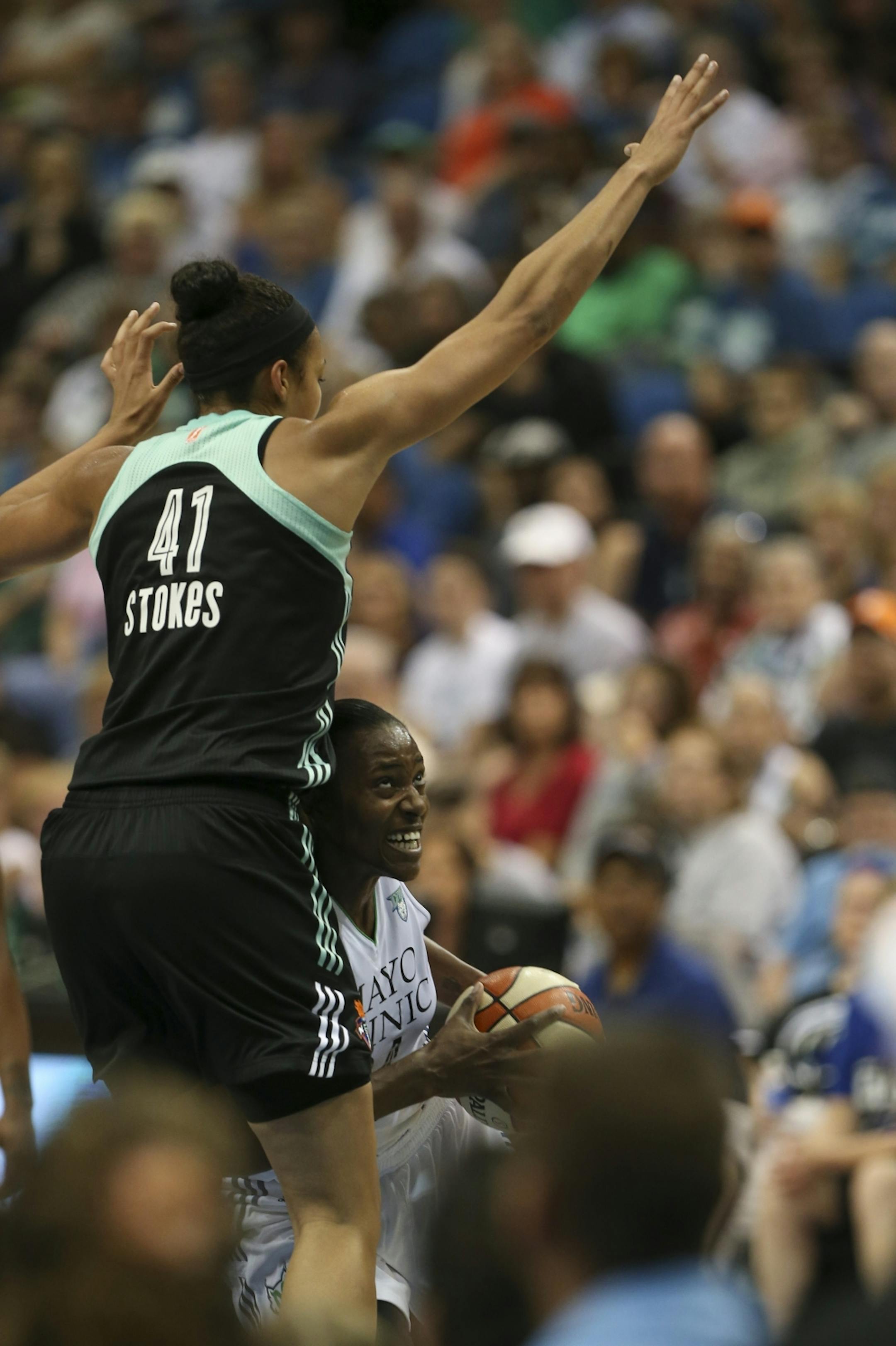 Minnesota Lynx center Sylvia Fowles (34) was defended under the Lynx net by New York Liberty center Kiah Stokes in the third quarter Sunday night.