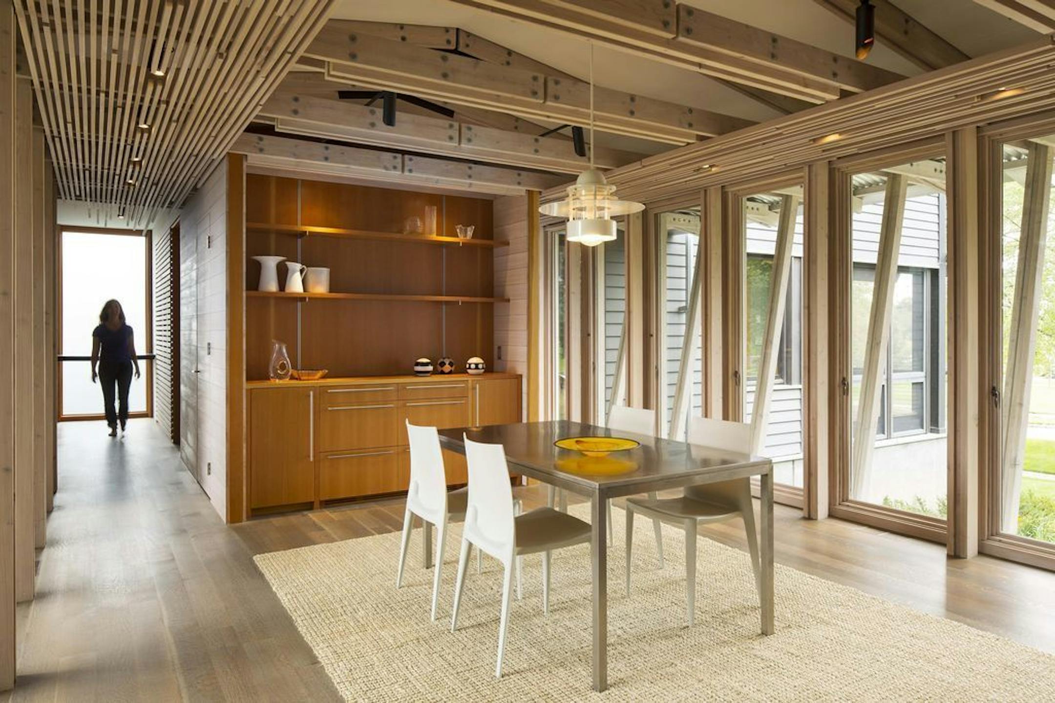 The dining area inside the glass bridge, designed by David O'Brien Wagner, SALA Architects.