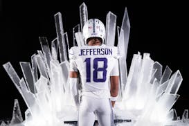 Vikings wide receiver Justin Jefferson poses in the team's new alternate uniform, which includes icicle serifs in the numbers.