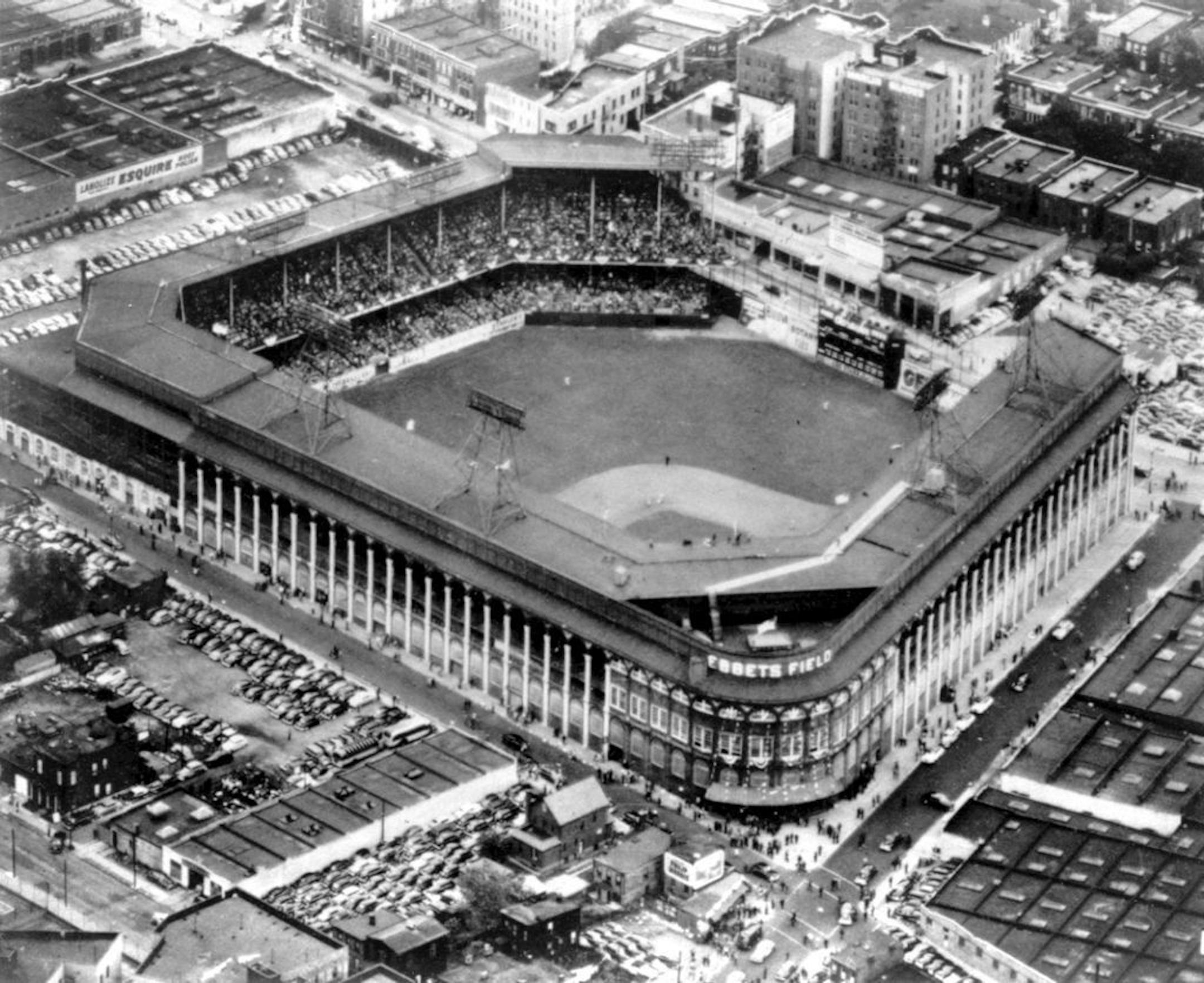 FILE - This file photo of Sept. 13, 1942 gives an aerial view of Ebbets Field, home to the Brooklyn Dodgers baseball team, in Brooklyn, New York. It was like a death in the family for Brooklyn baseball fans when their beloved Dodgers left the borough behind for the California coast. But after decades without a professional sports team, Brooklyn is hitting the major leagues again on Friday, Sept. 21, 2012 when the Brooklyn Nets� new arena opens to the public.