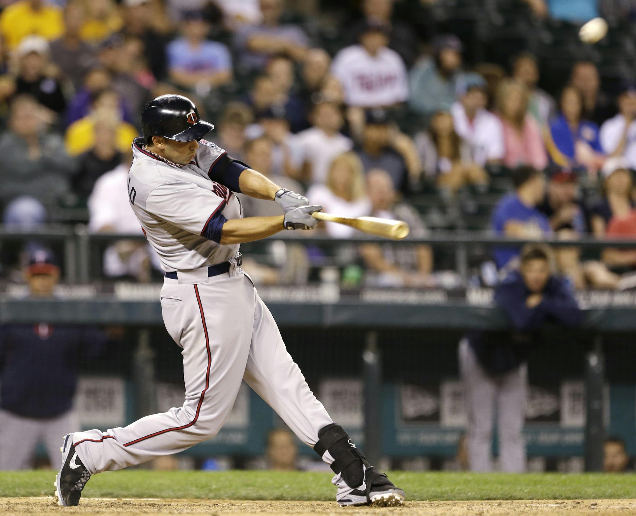 Minnesota Twins' Chris Colabello hits a two-run home run against the Seattle Mariners in the 13th inning of a baseball game Friday, July 26, 2013, in Seattle. (AP Photo/Elaine Thompson)