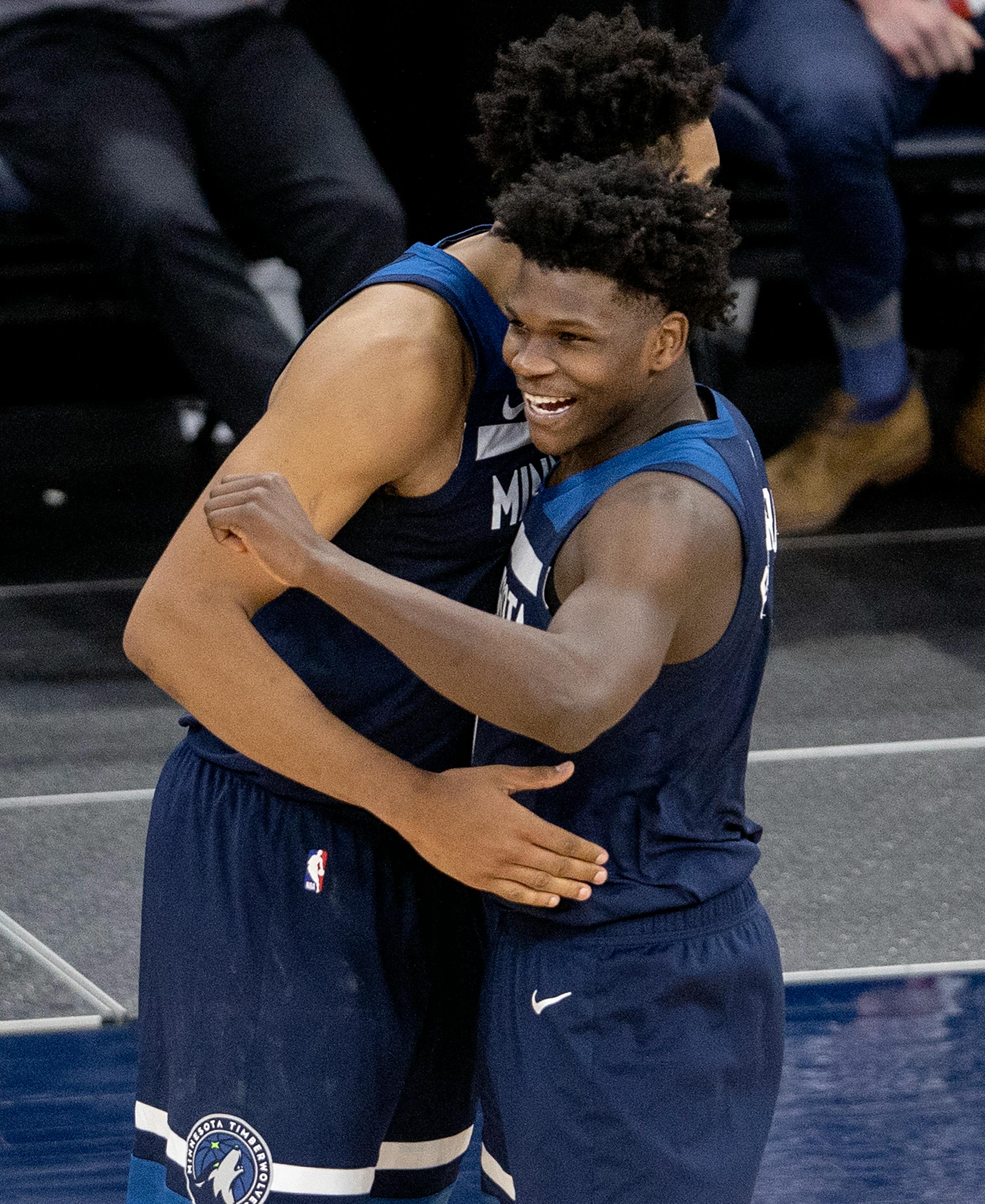 Karl-Anthony Towns (32) and Anthony Edwards (1) of the Minnesota Timberwolves celebrated at the end of the game.