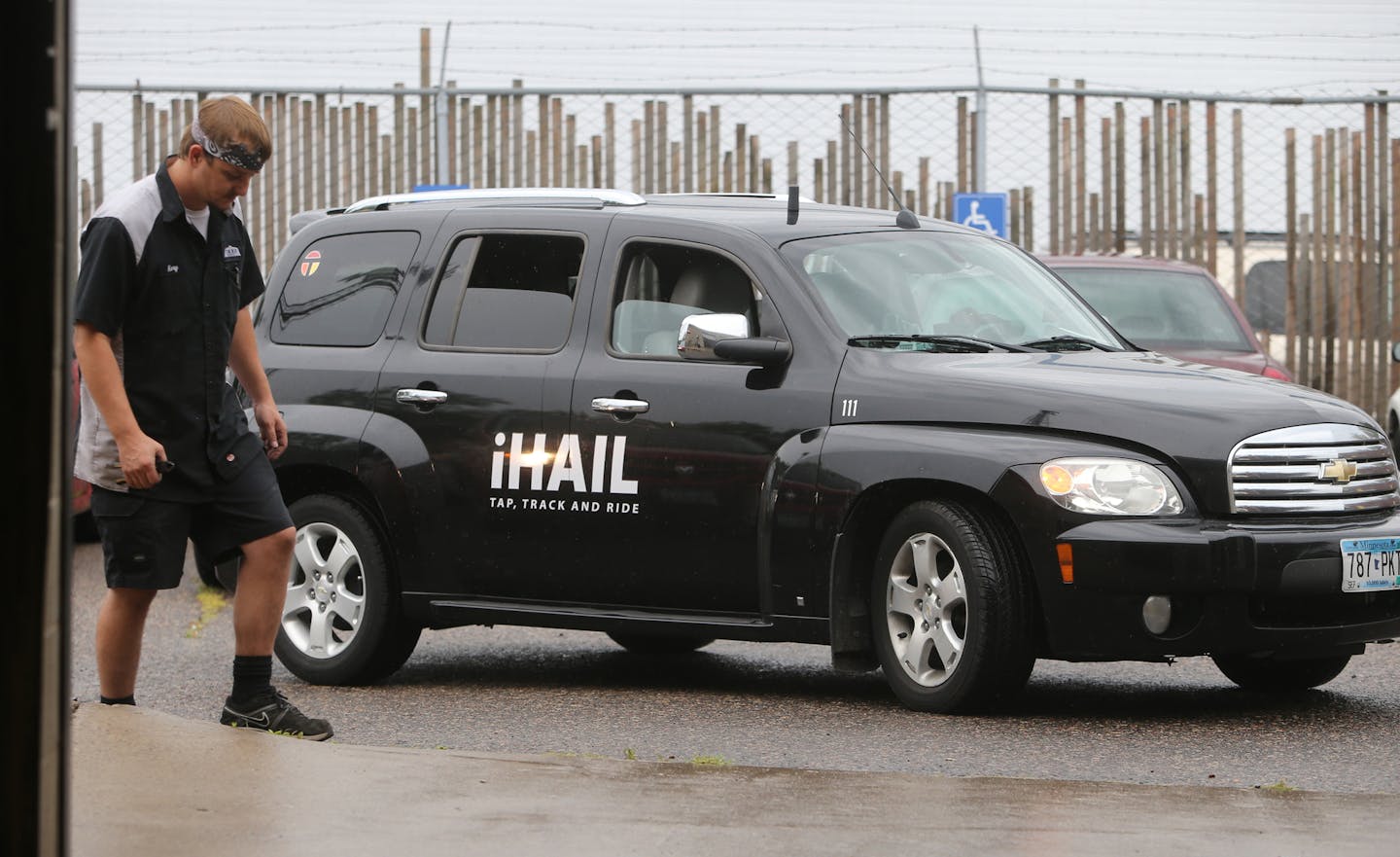 An iHail.com taxi left Taxi Service's New Hope garage, ready to be dispatched by app in the traditional cab company's efforts to combat ride-sharing giants Uber and Lyft.